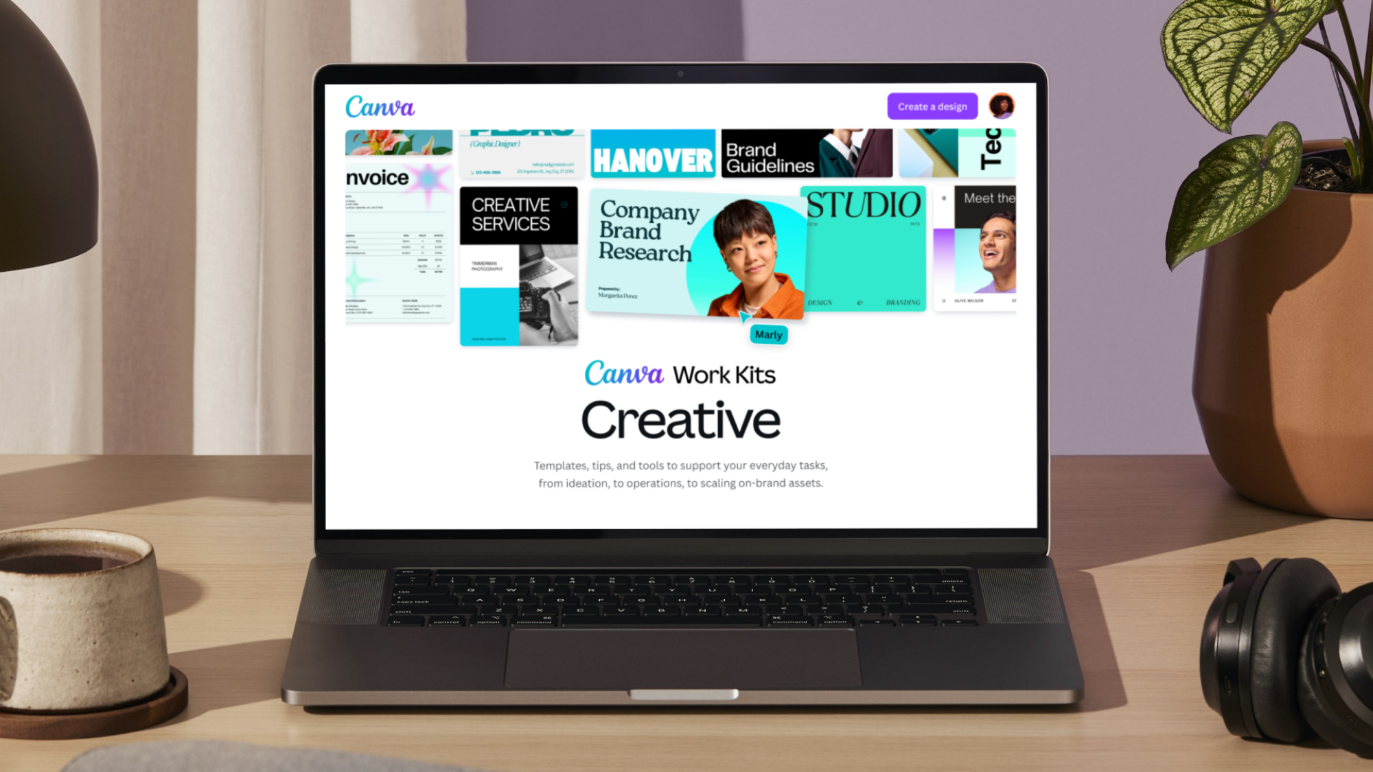 A picture of a laptop displaying Canva's creative work kit.