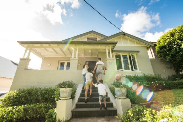 Family walking into their home