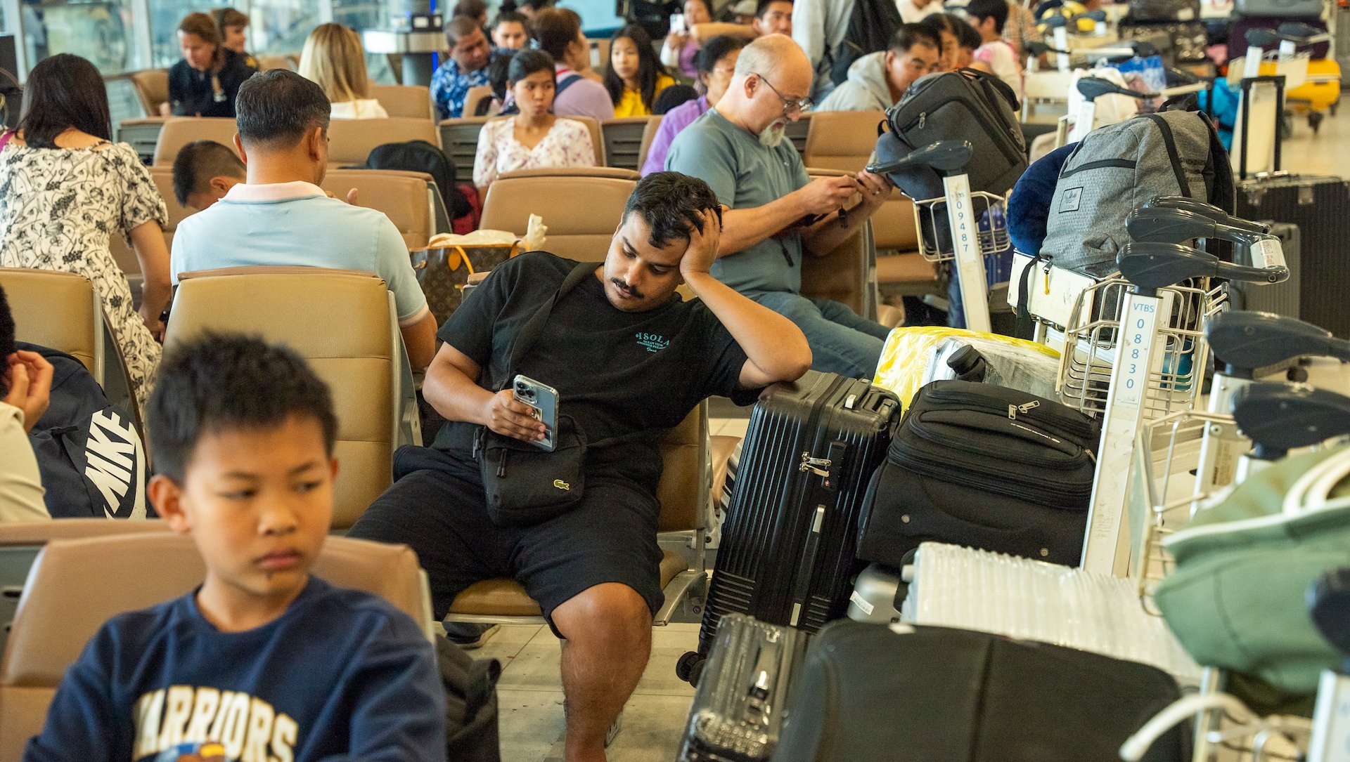 Passengers seated at Suvarnabhumi Airport in Bangkok, Thailand on July 19.