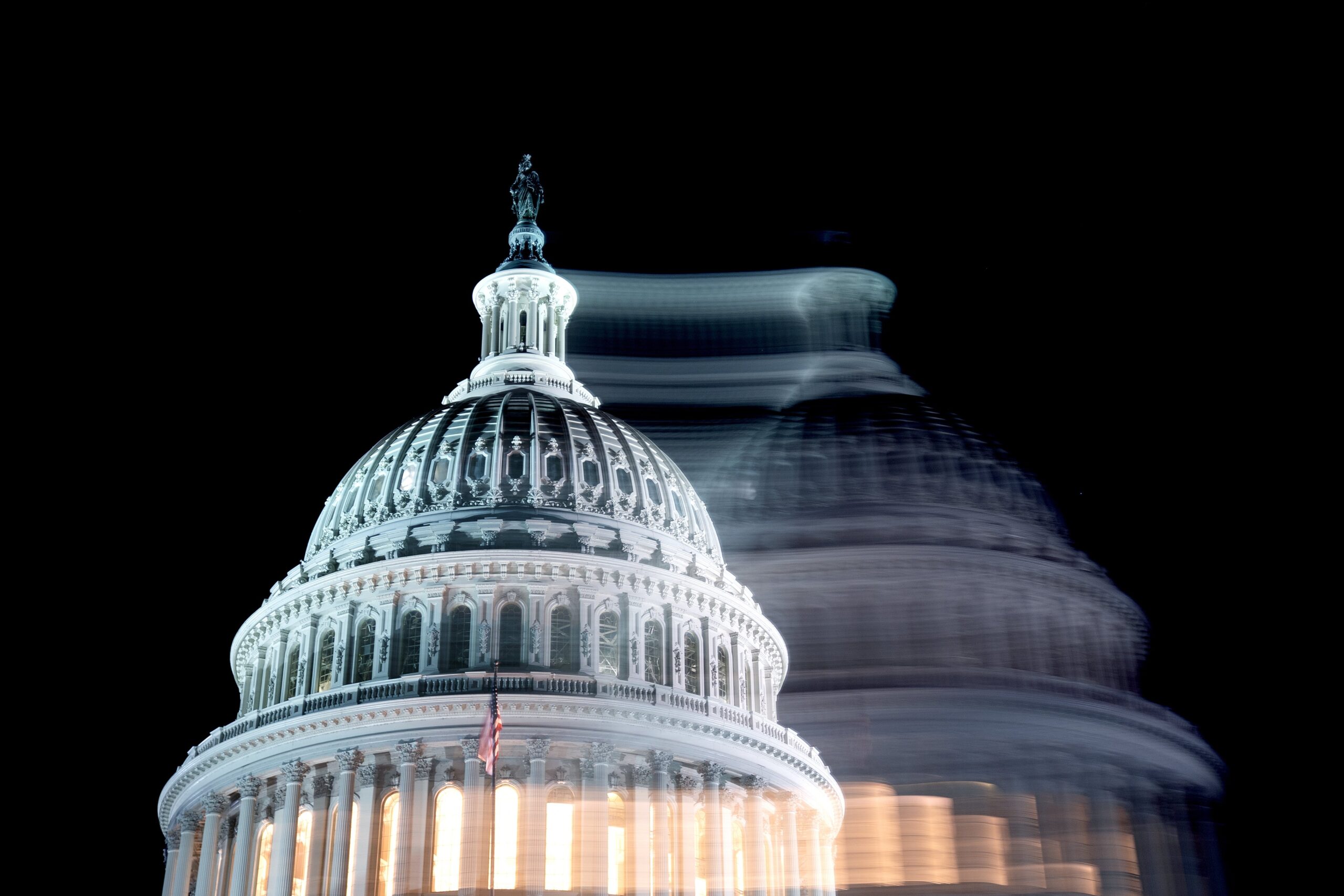 A photo of the U.S. capitol dome, blurred to look as if there are two of them.