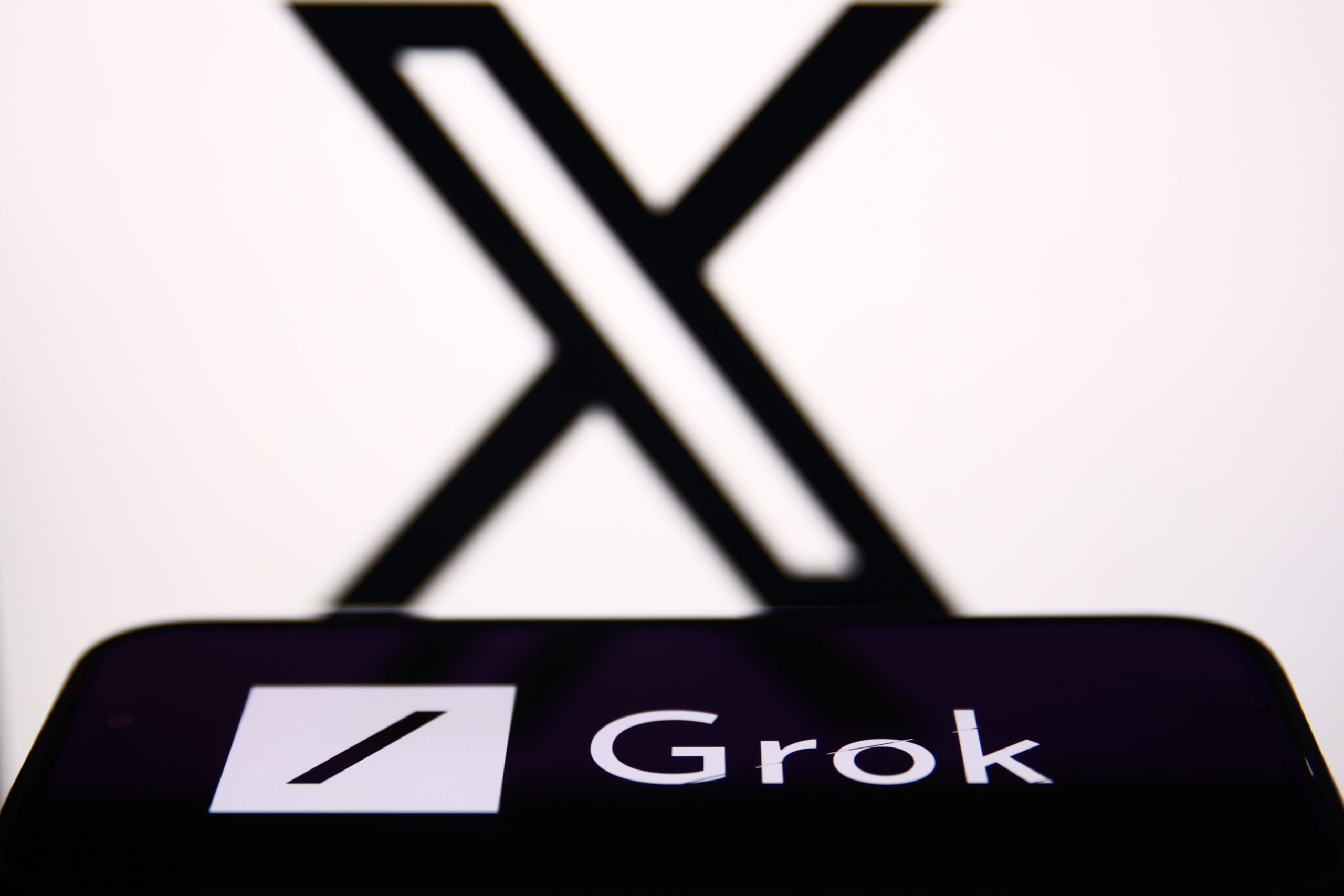 Grok and X logos