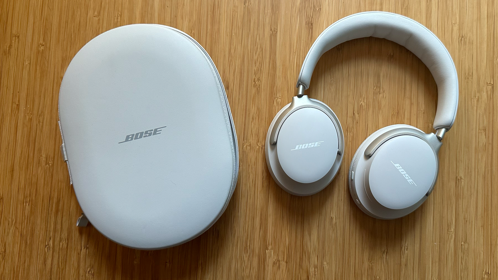 A pair of Bose QuietComfort Ultra headphones on a table