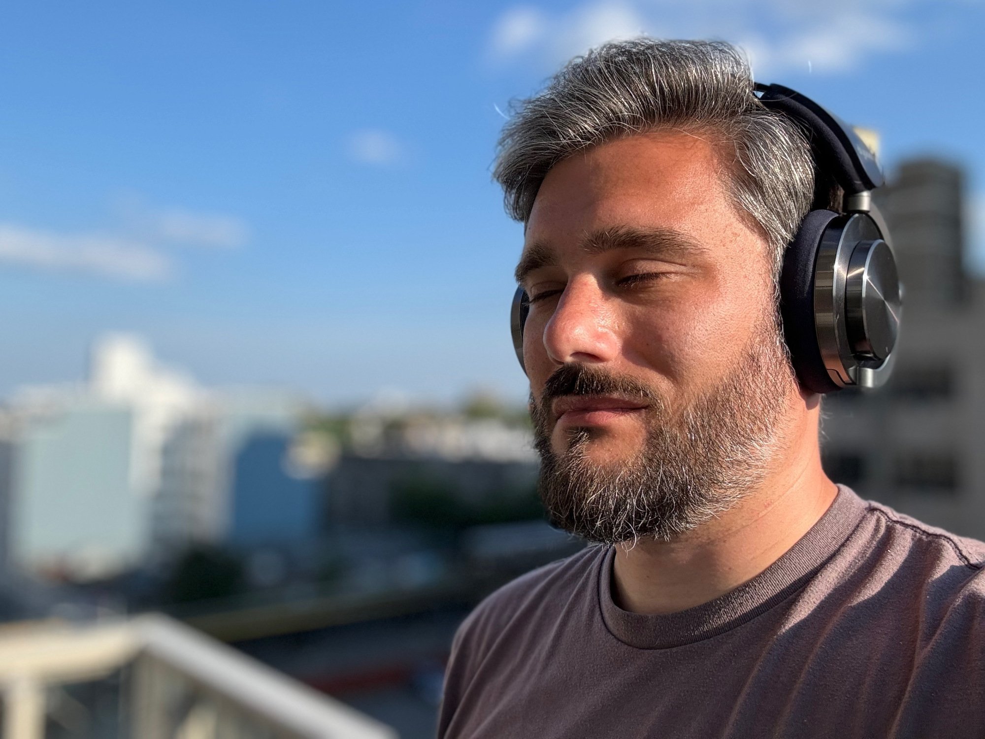 man listening to music with dyson ontrac headphones