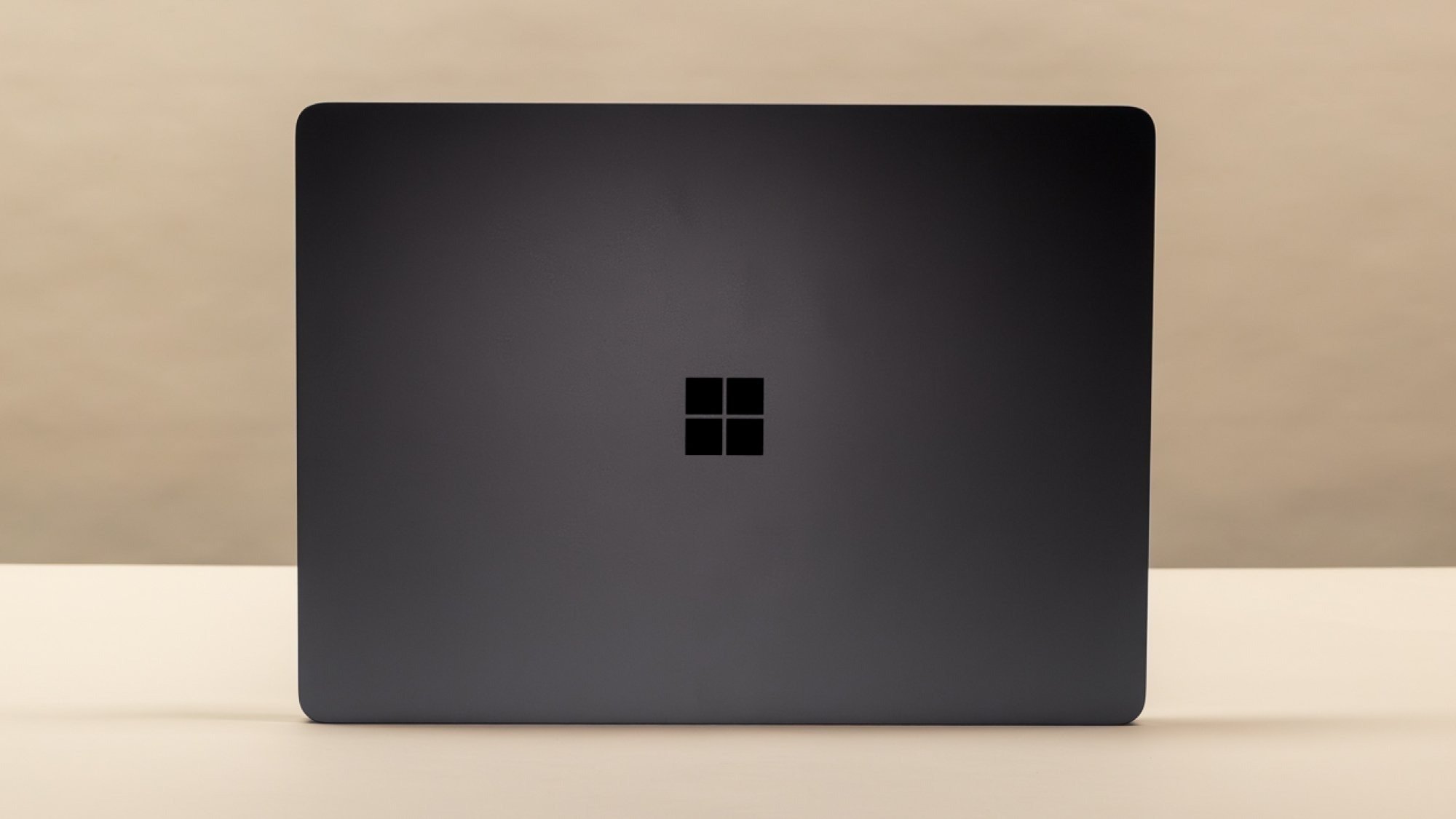 Microsoft Surface Laptop 7 in front of a beige background