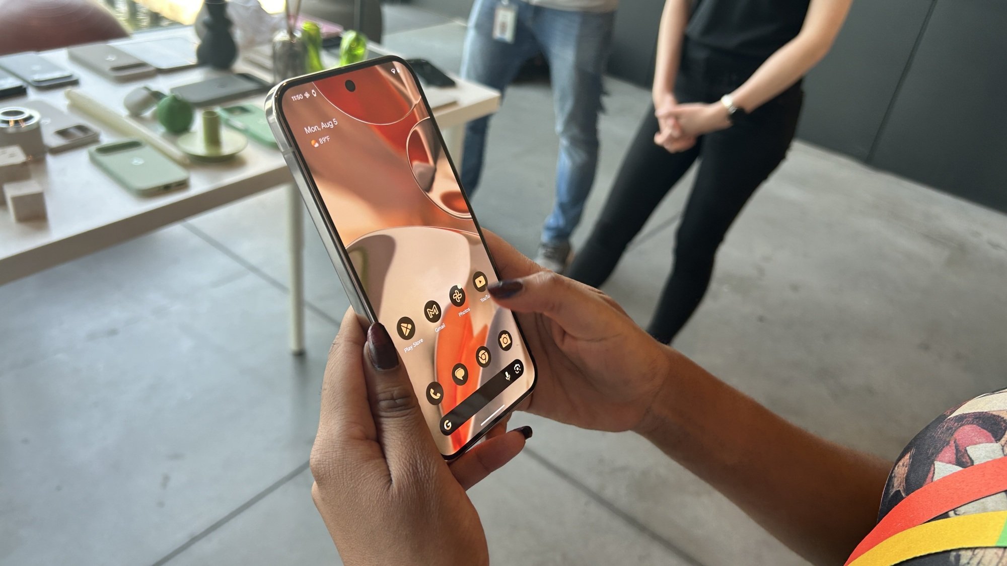 Woman holding Pixel 9 Pro XL display