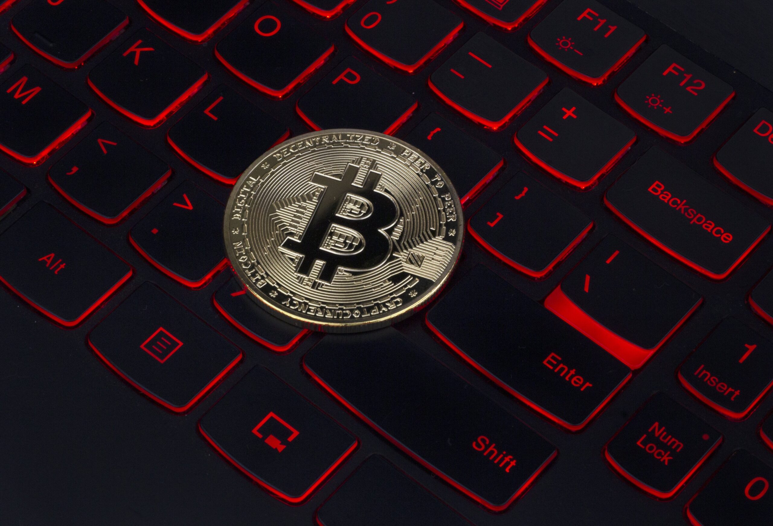 Bitcoin on a red backlit keyboard