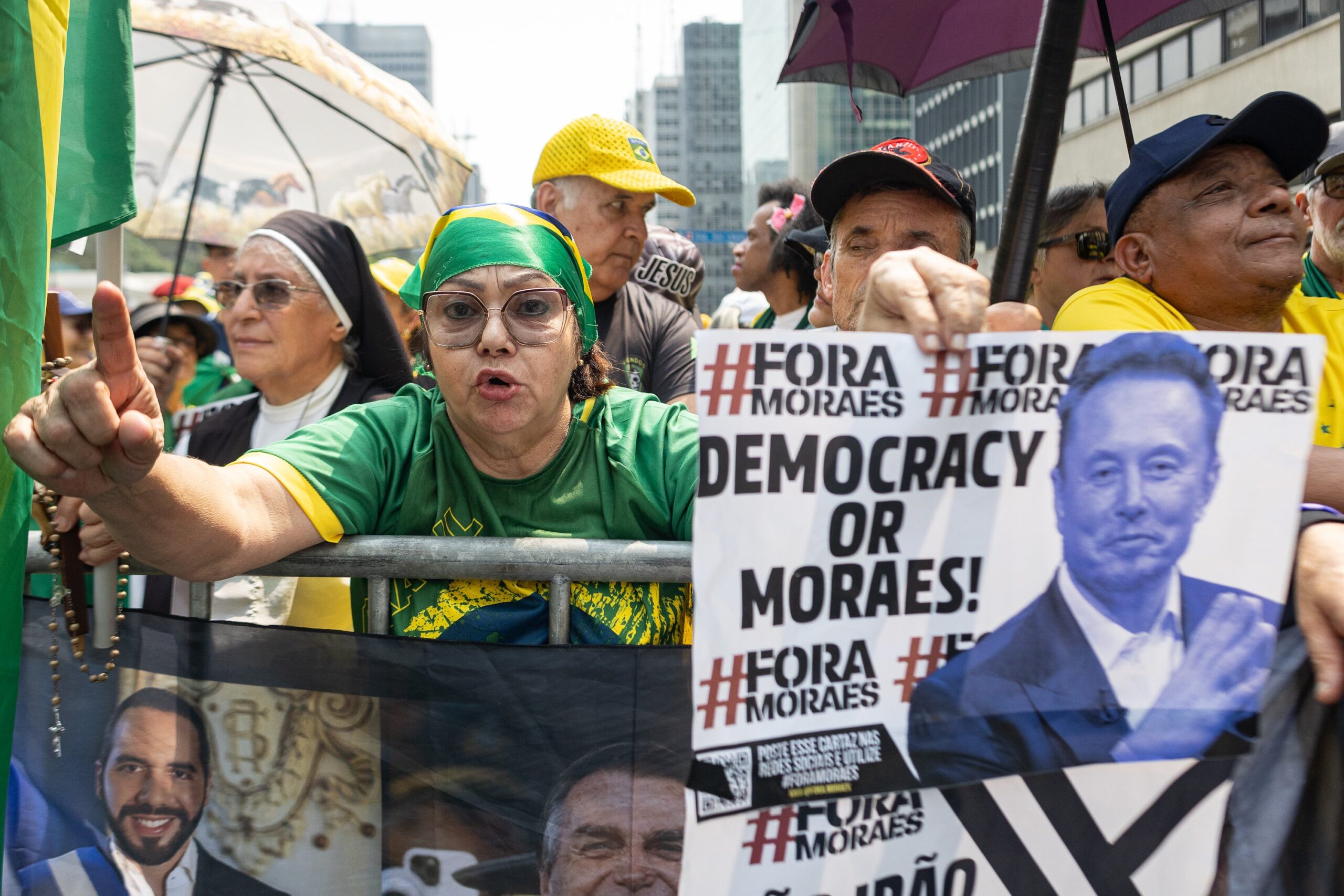brazil rallygoes with a sign that has a picture of elon musk