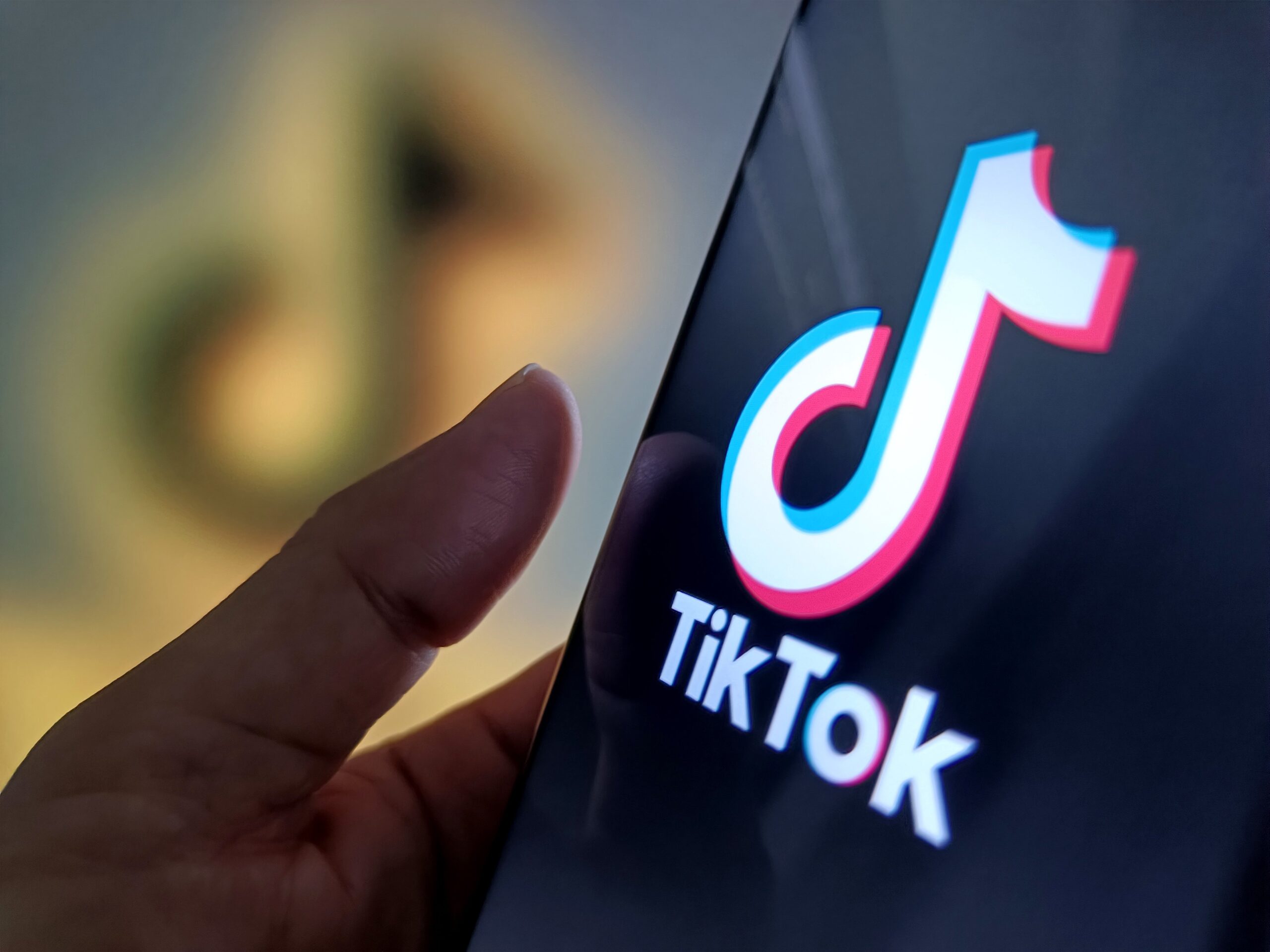 An illustration of the tiktok logo inside a phone