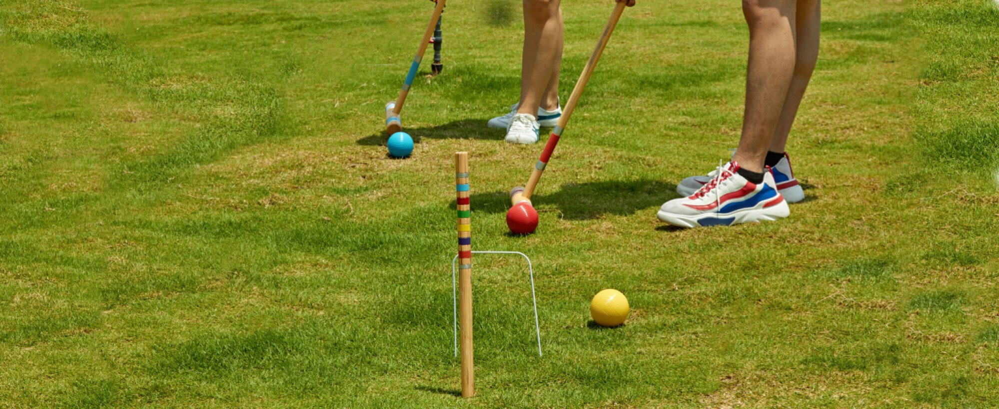 two people playing croquet