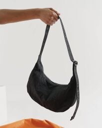 hand holding bag strap