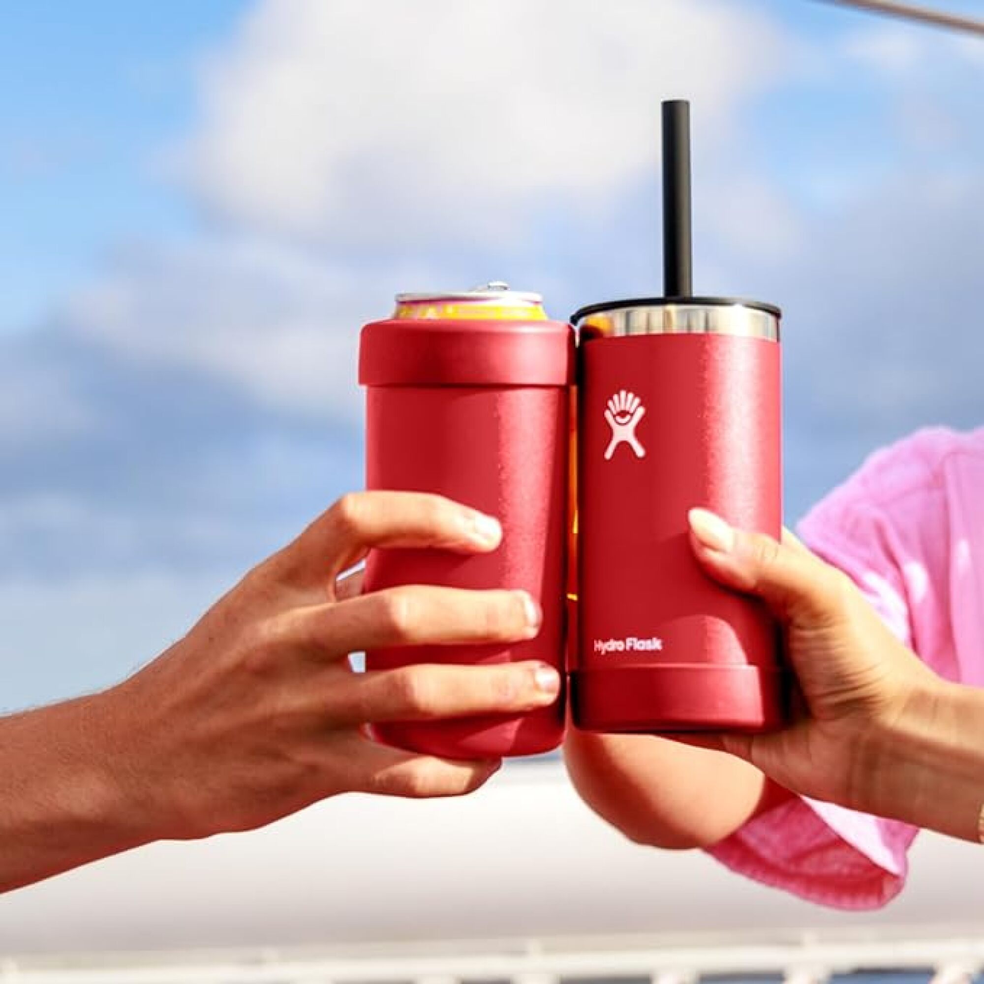 hands clinking hydro flask cooler cups