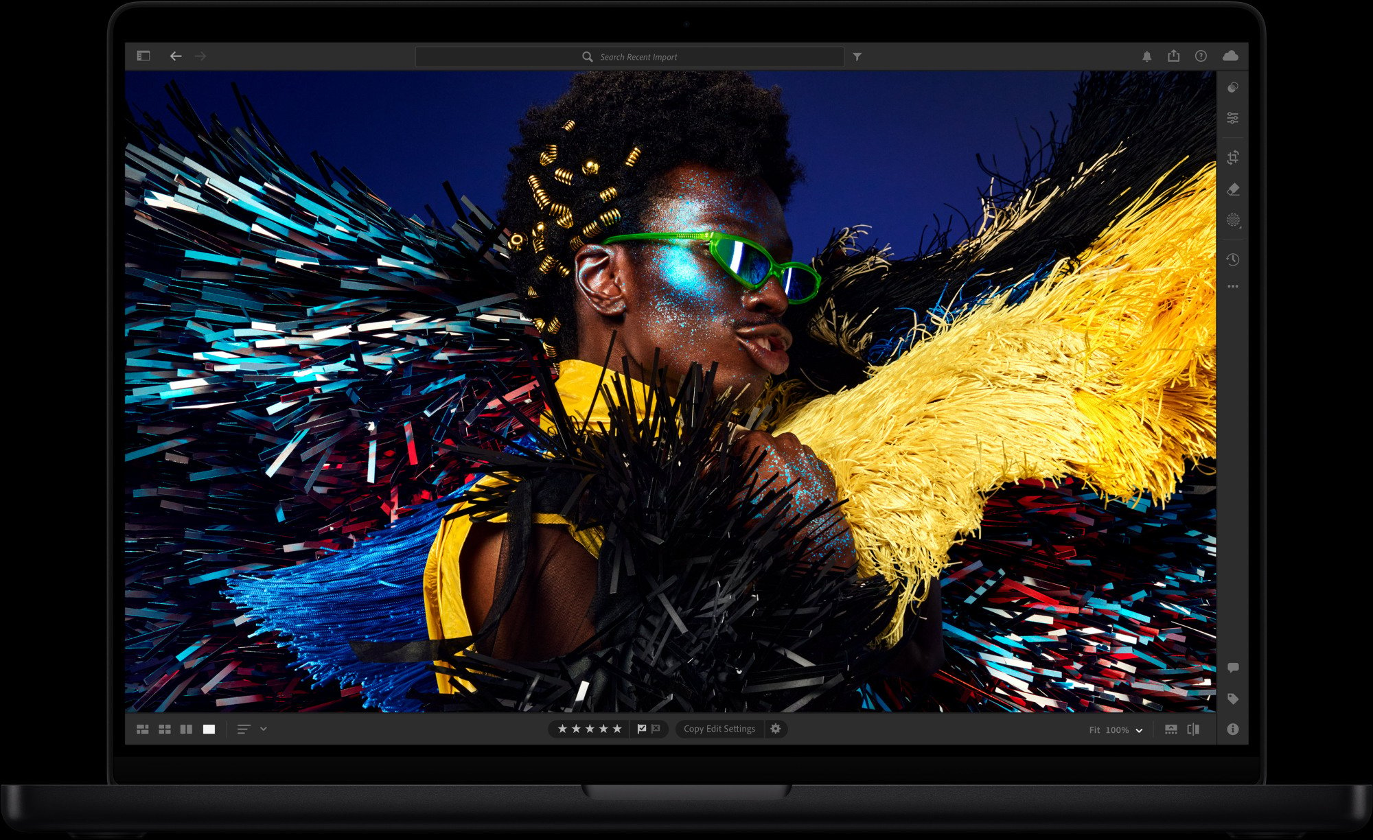 M4 MacBook Pro showcasing a vivid photo of a colorful man