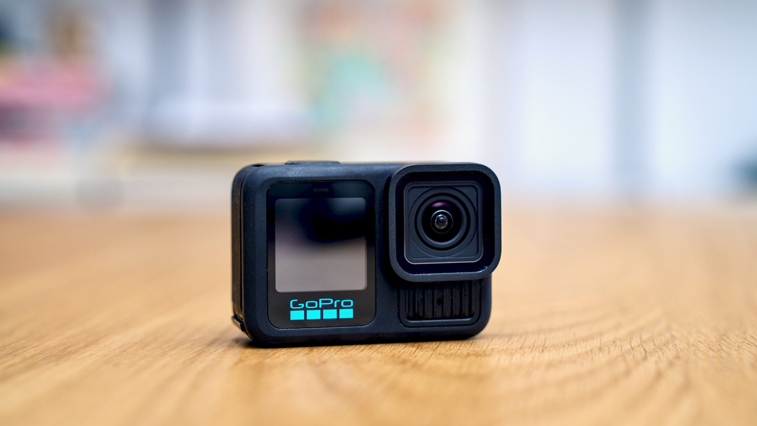 gopro hero 13 black action camera on wood tabletop