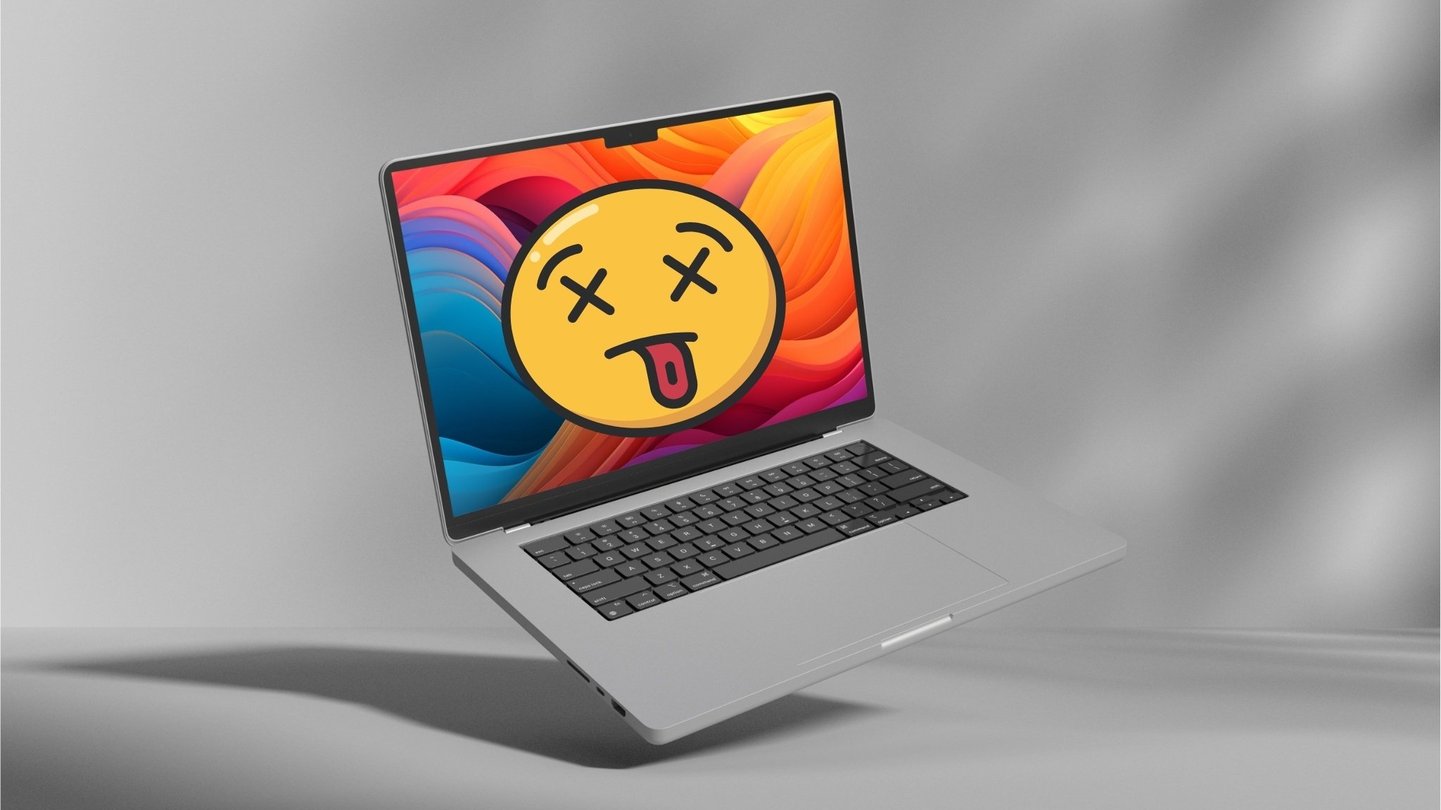 M2 MacBook Pro with a dead smiley face on it