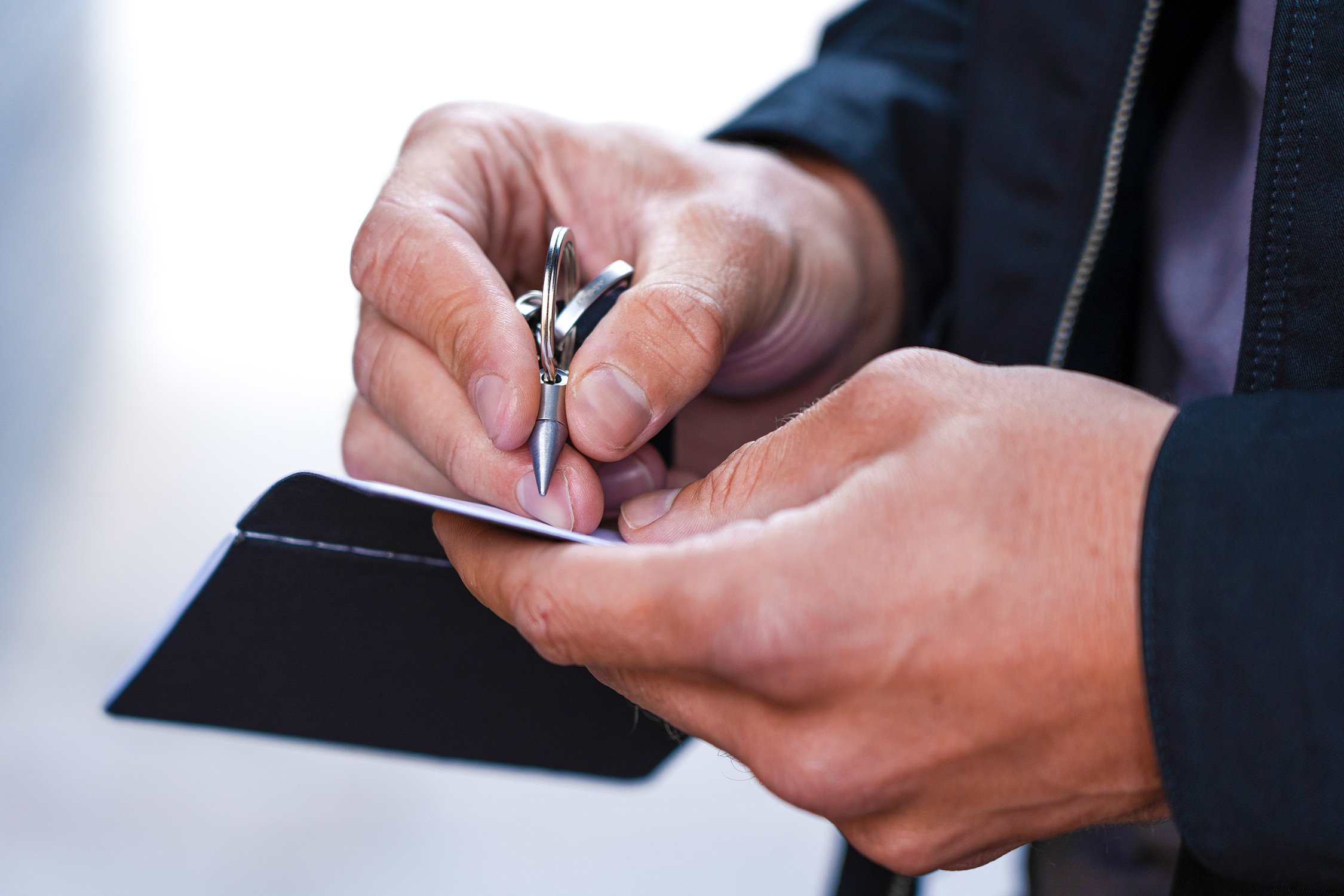 man writing with inkless ForeverPen 