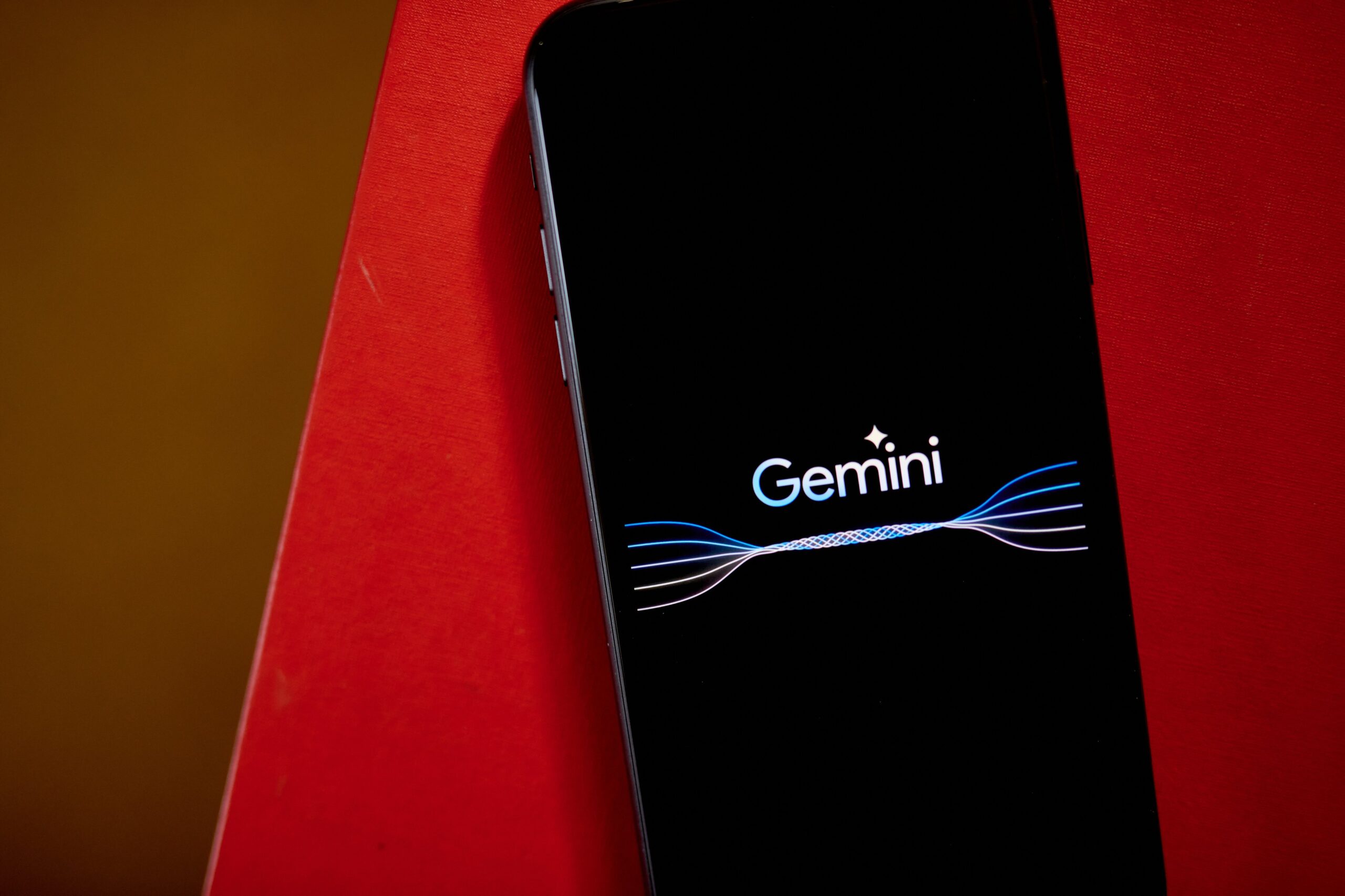The Gemini logo on a smartphone