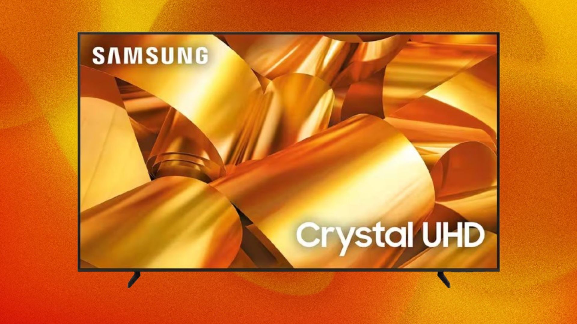 A Samsung TV appears on an orange and yellow abstract background, with golden ribbons on its screen.
