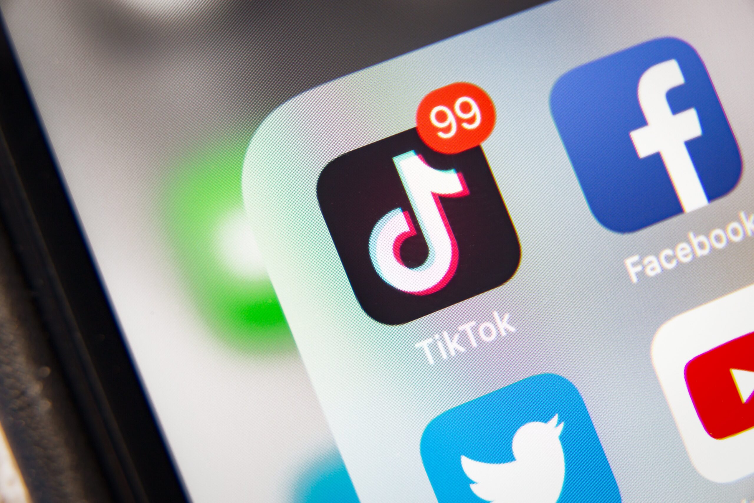 The TikTok app logo on a phone. 