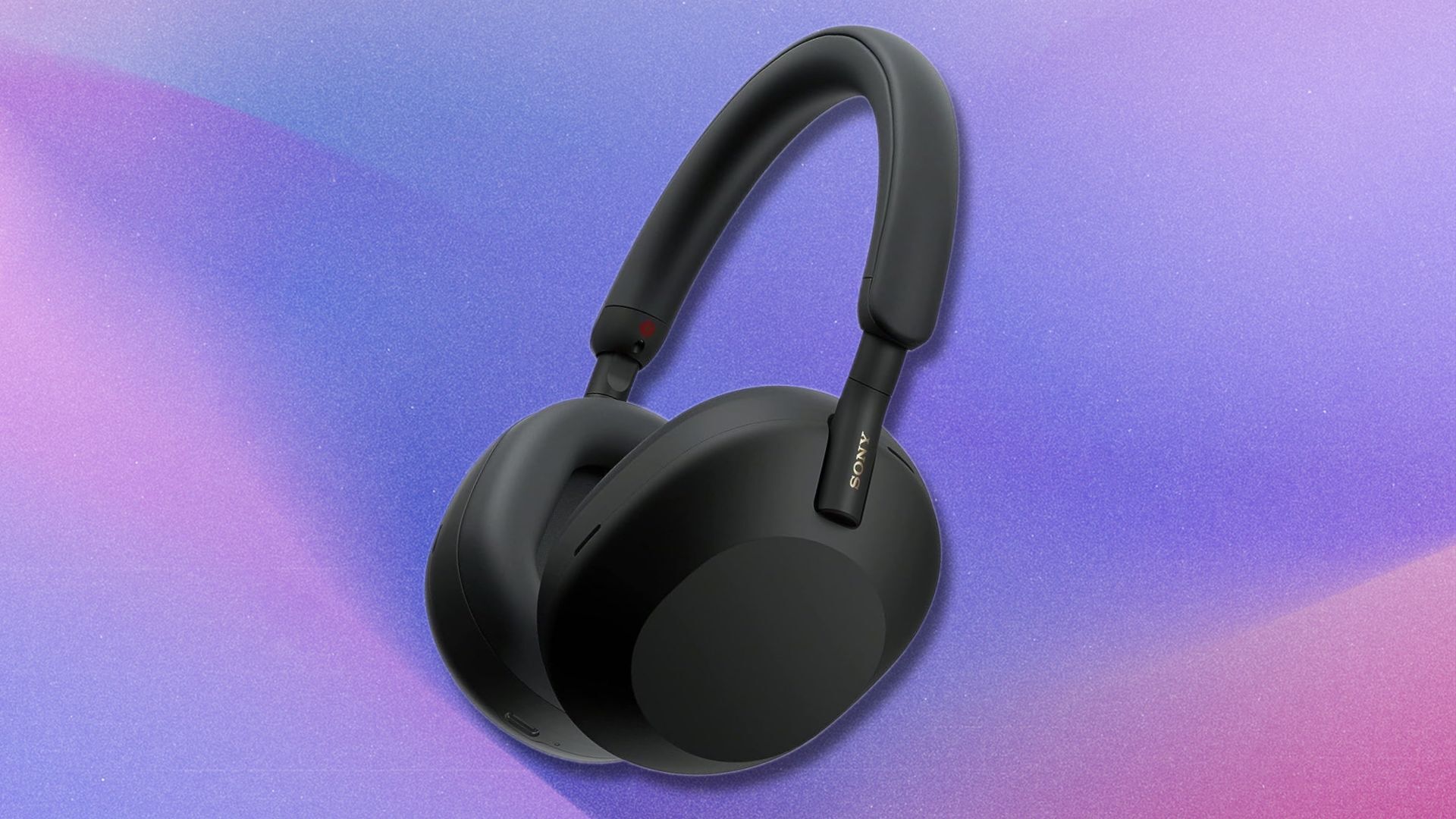 black sony wh1000xm5 headphones on a purple and pink gradient background