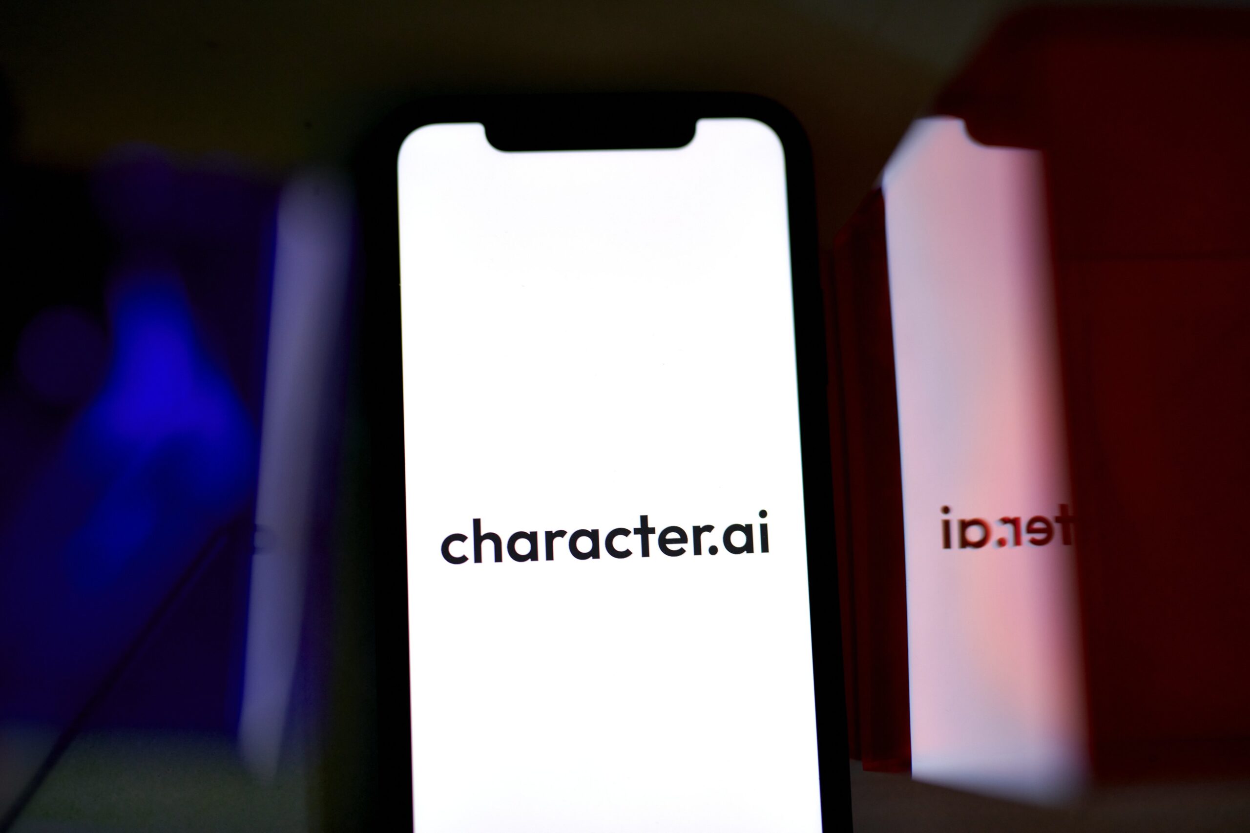 A phone screen showing the Character.AI logo.