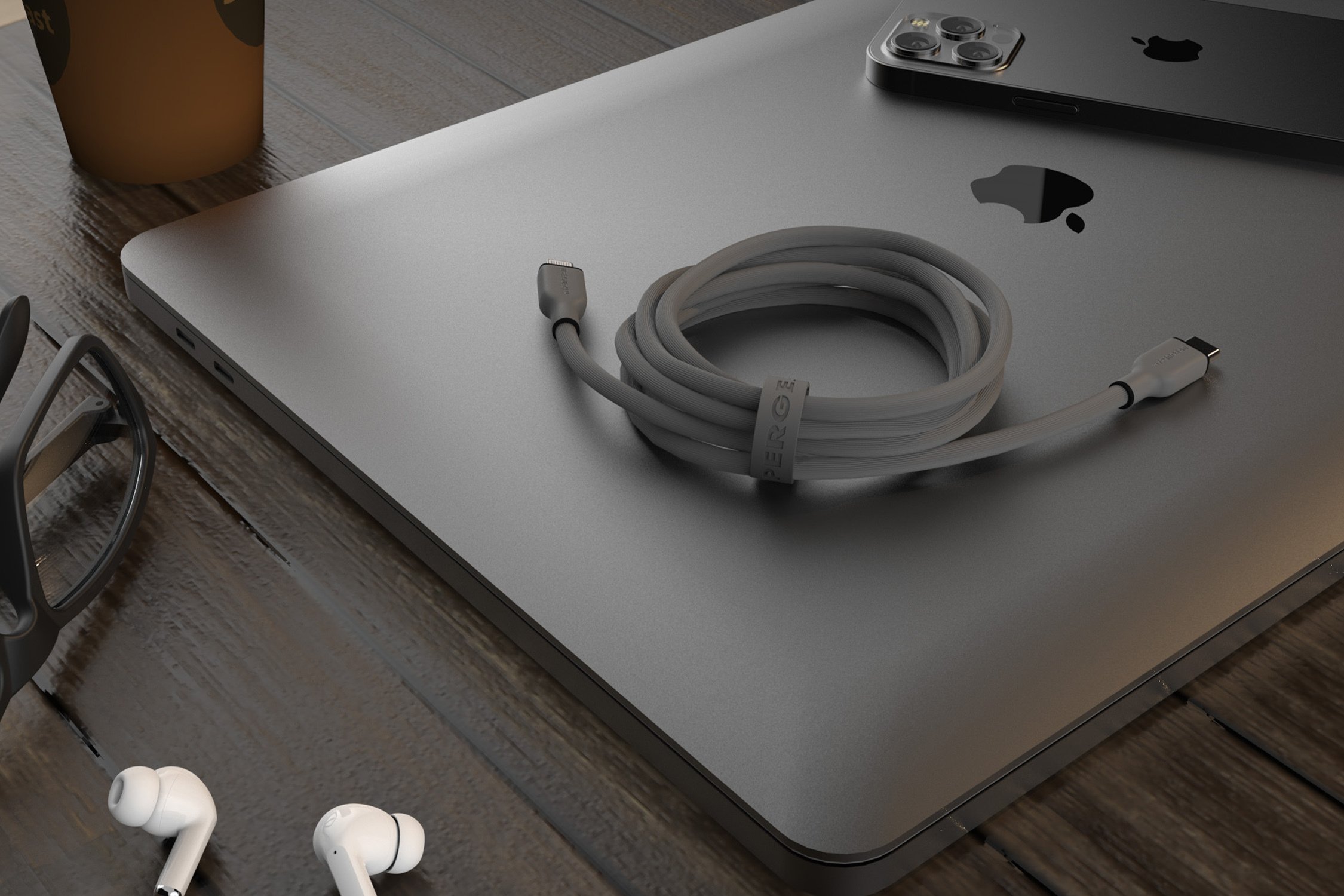 Flexi Pro charging cable on laptop with airpods