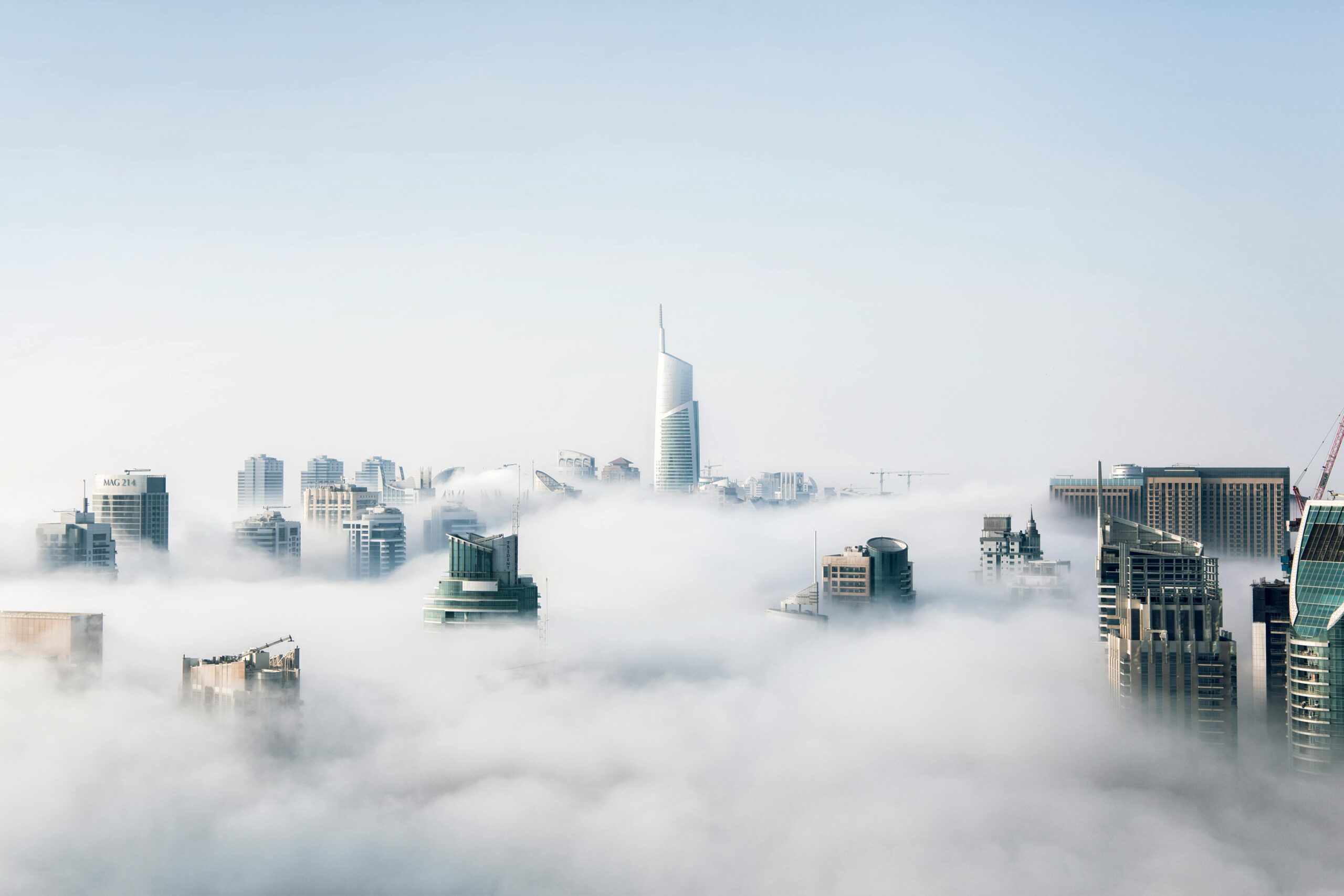 the new york city skyline shrouded in clouds