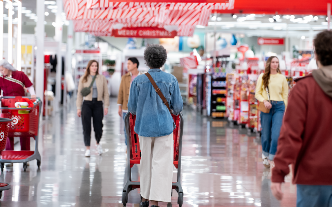 A busy aisle at Target with people shopping