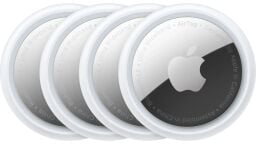 Four circular Apple AirTags appear on a white background with their metal glinting.