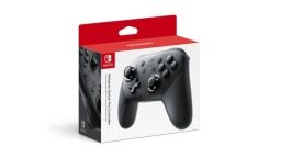 A Nintendo Switch Pro Controller appears in its packaging on a white background.