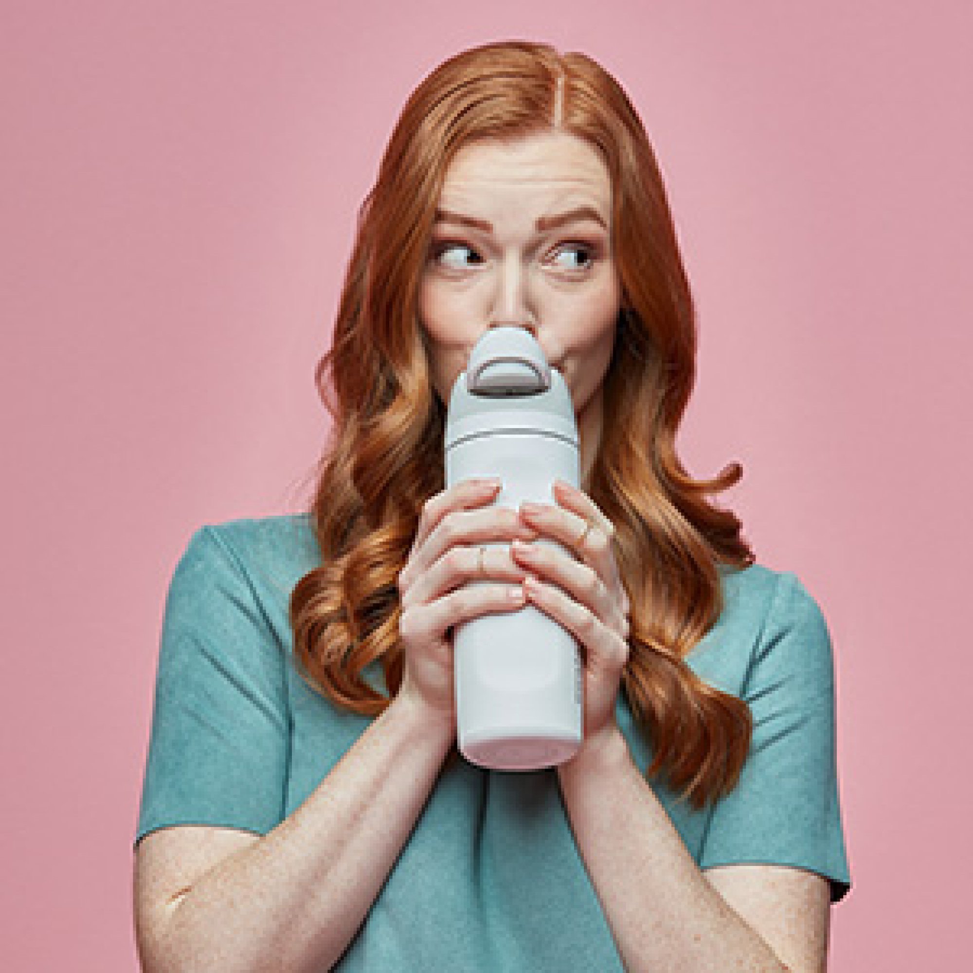 woman drinking from owala bottle