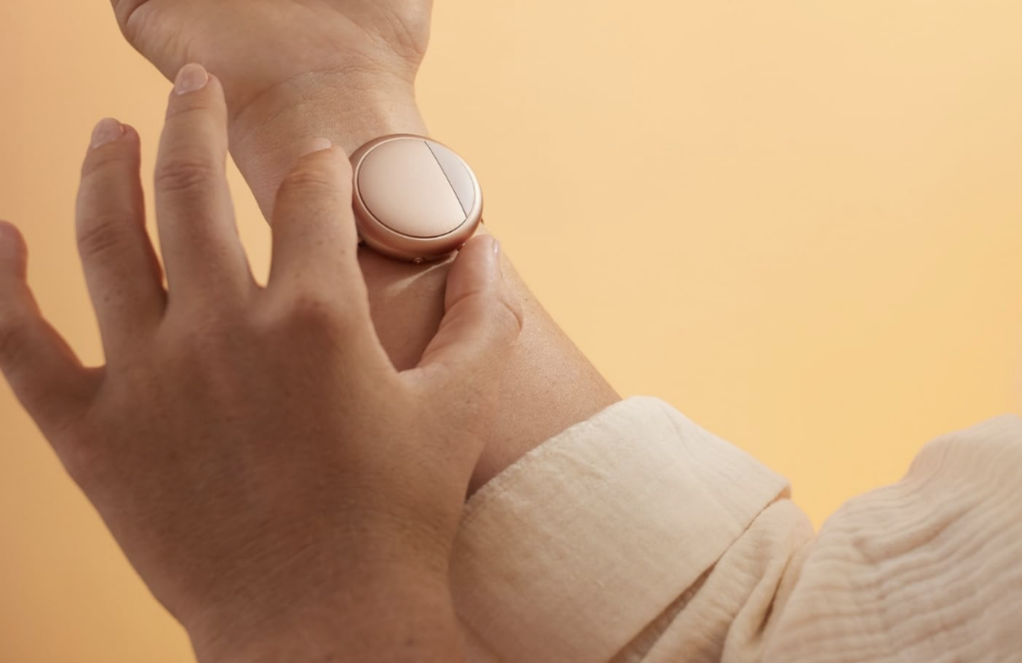 person adjusting cooling bracelet