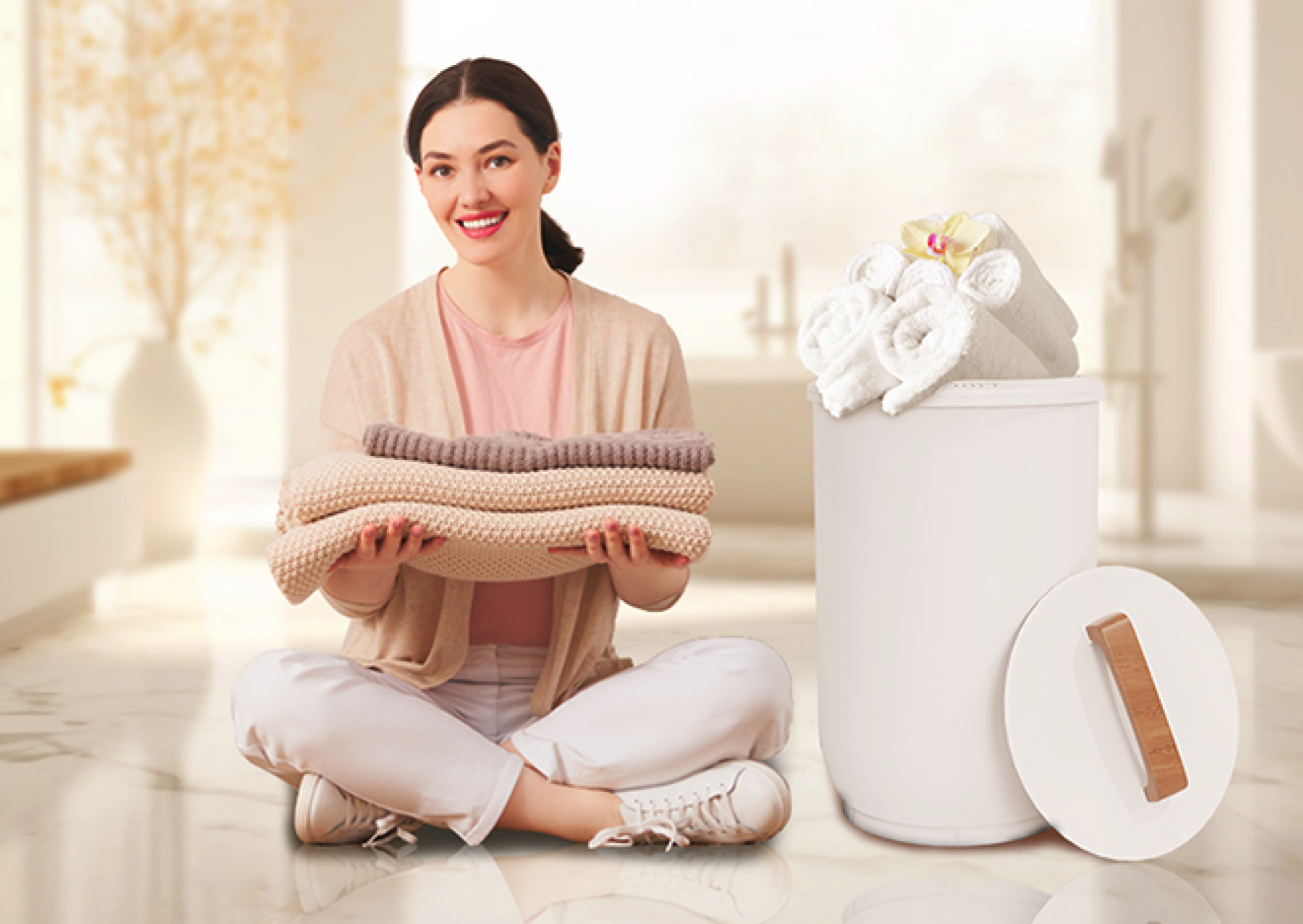 woman folding towels