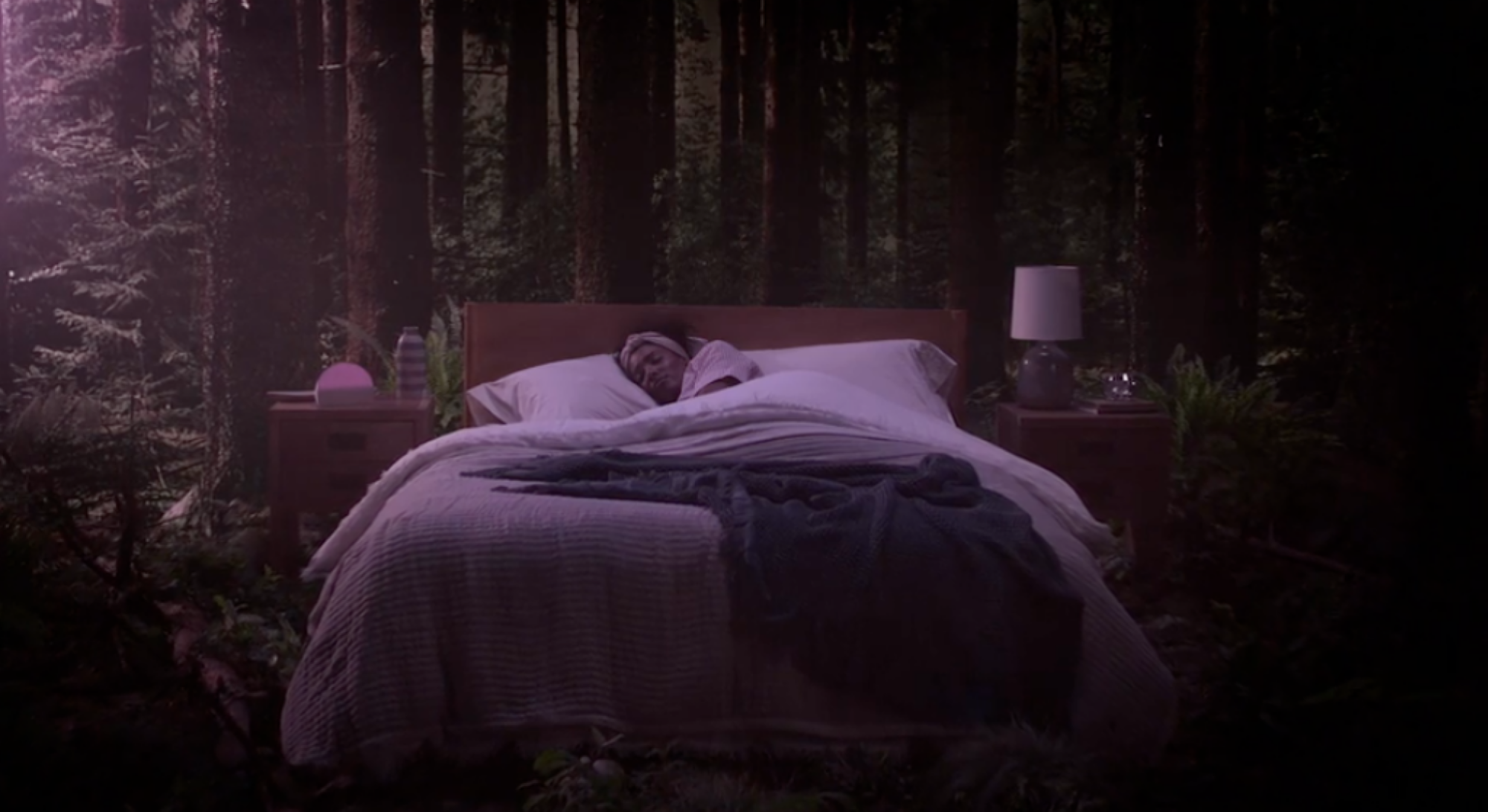 woman sleeping next to hatch alarm clock