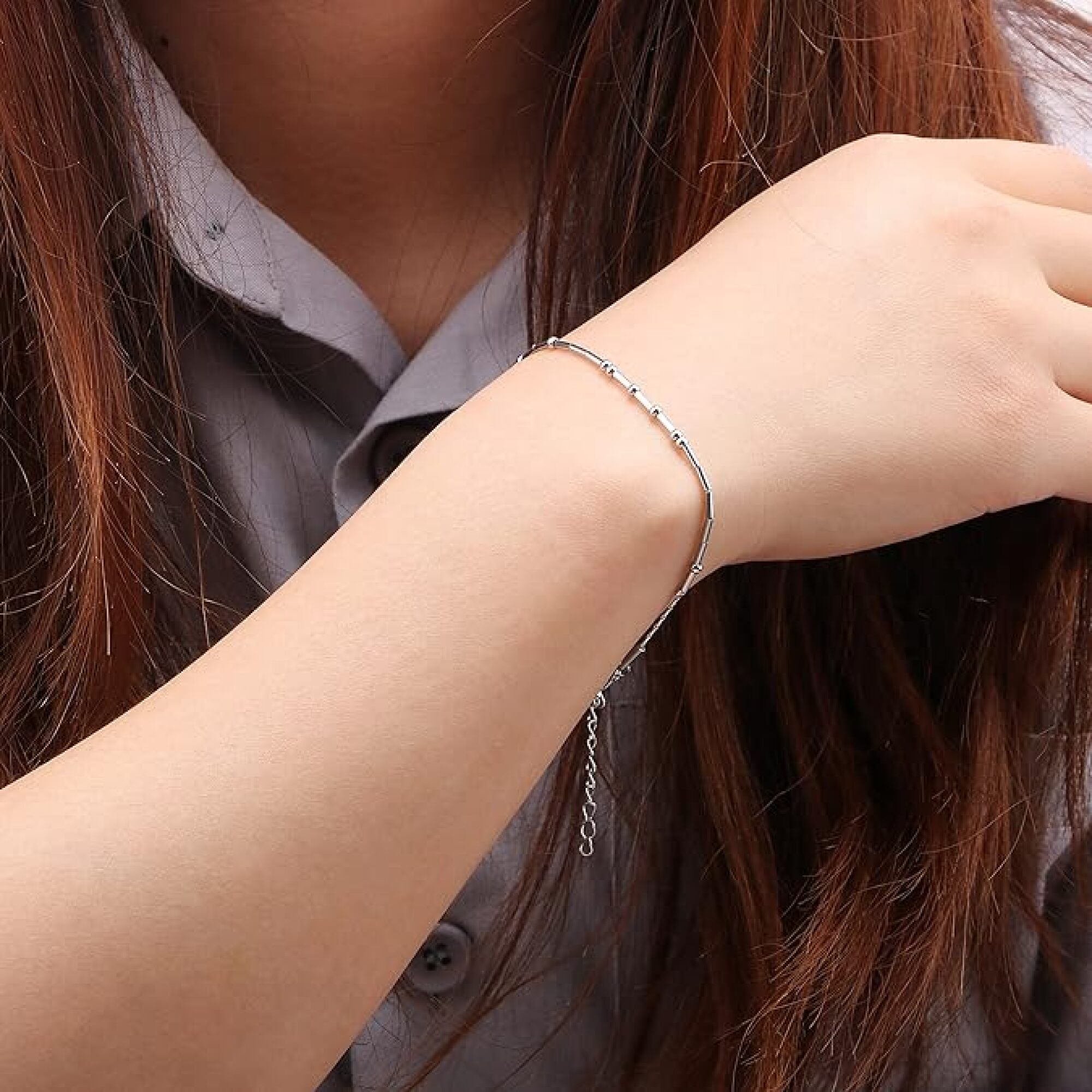 woman wearing silver bracelet