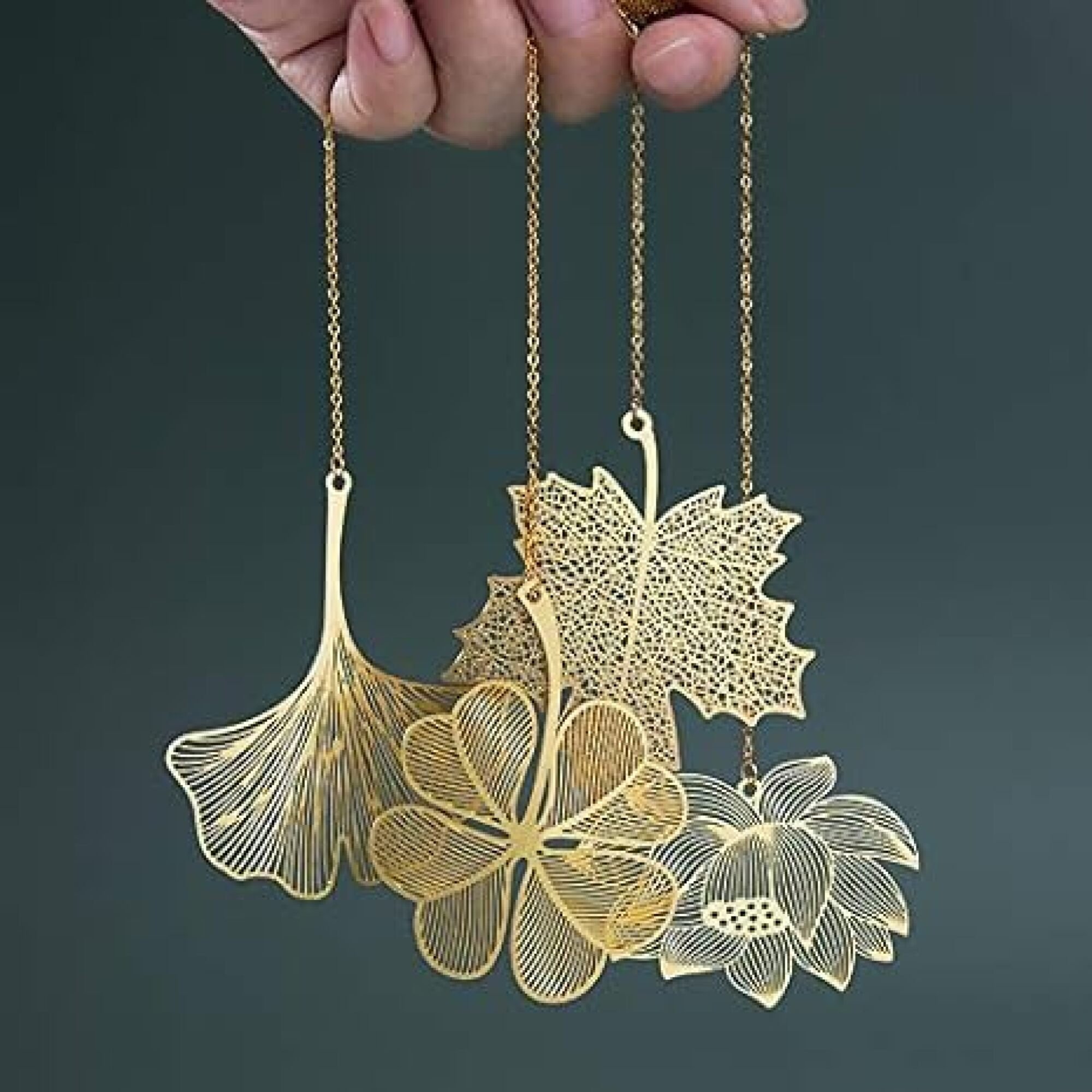 hand dangling gold bookmarks