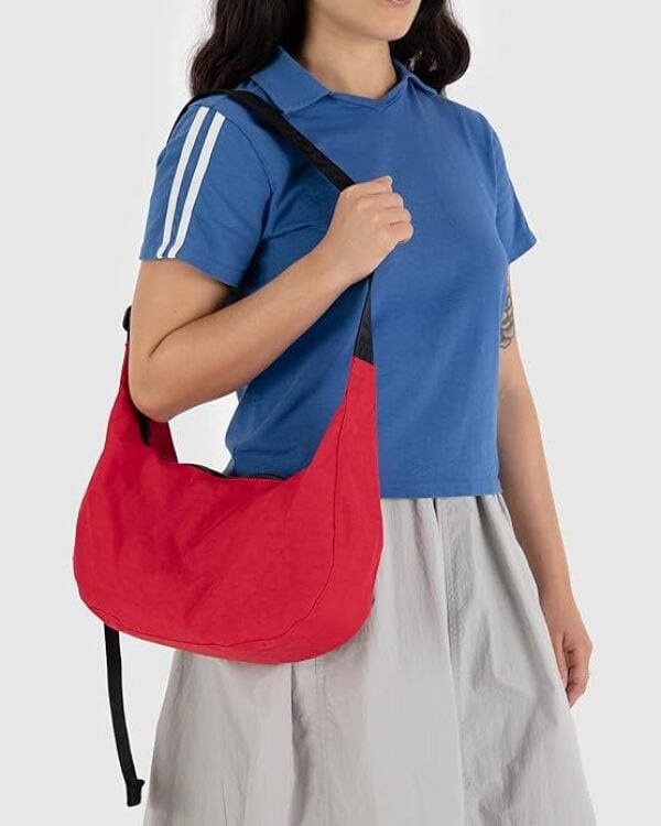woman holding red bag