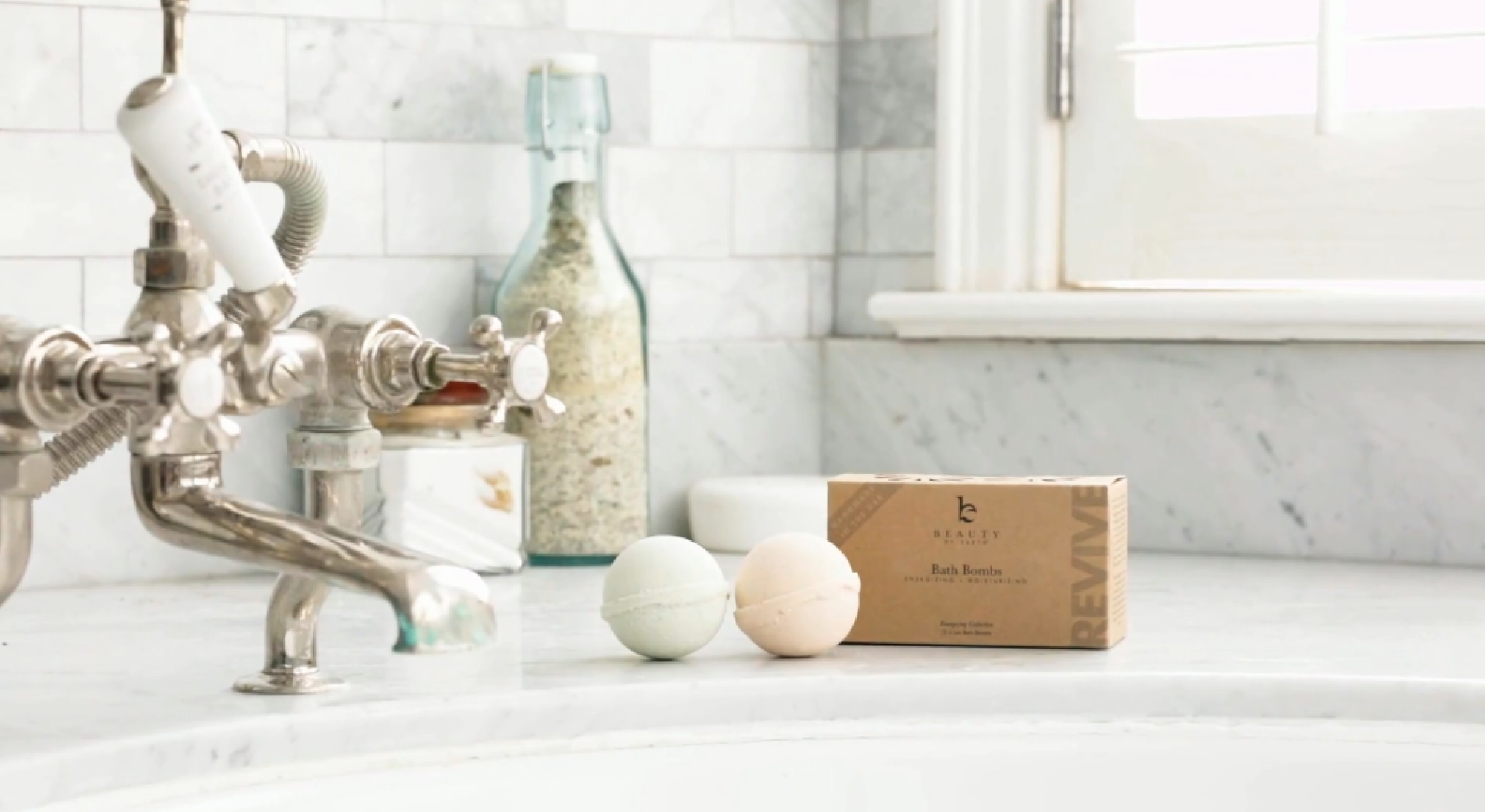 bath bombs on the ledge of a bath