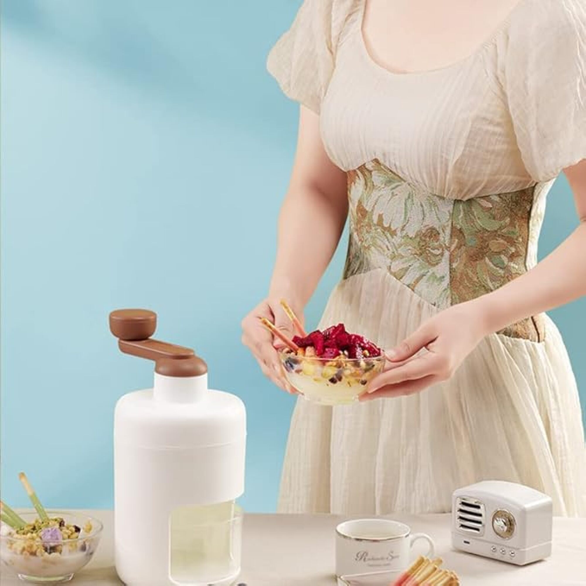 woman holding shaved ice next to shaved ice machine