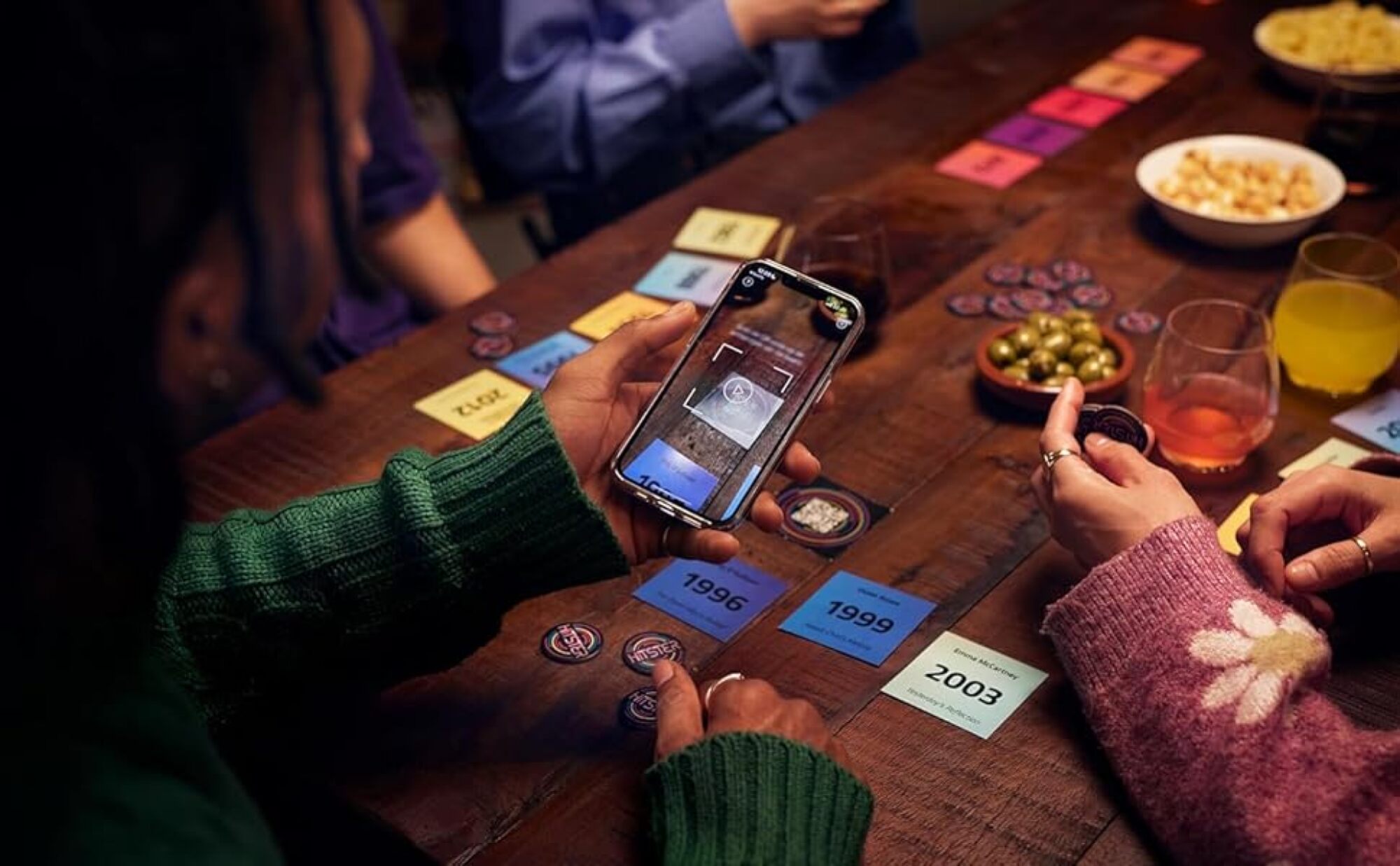 person scanning game card with phone camera