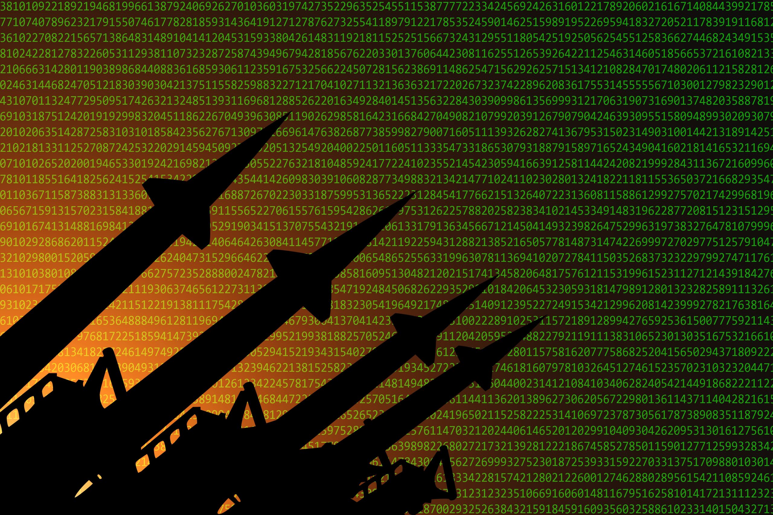 A row of missiles in front of a background filed with lines of computer code. 