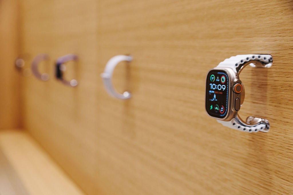 Apple Watches on wall display at Apple Store in Spain