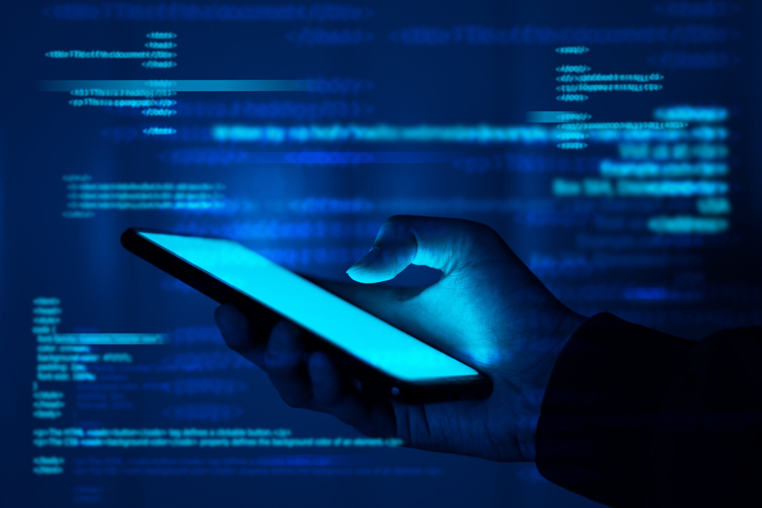 A hand holds a phone in a glowing blue environment filled with floating lines of computer code.