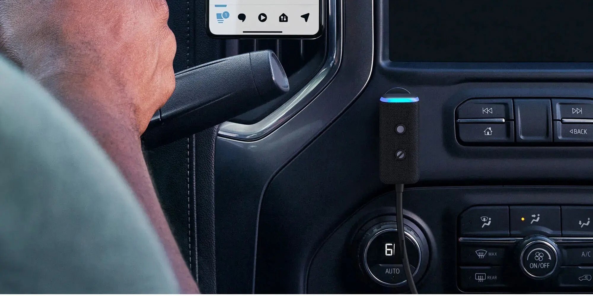 an amazon echo auto mounted inside of a car