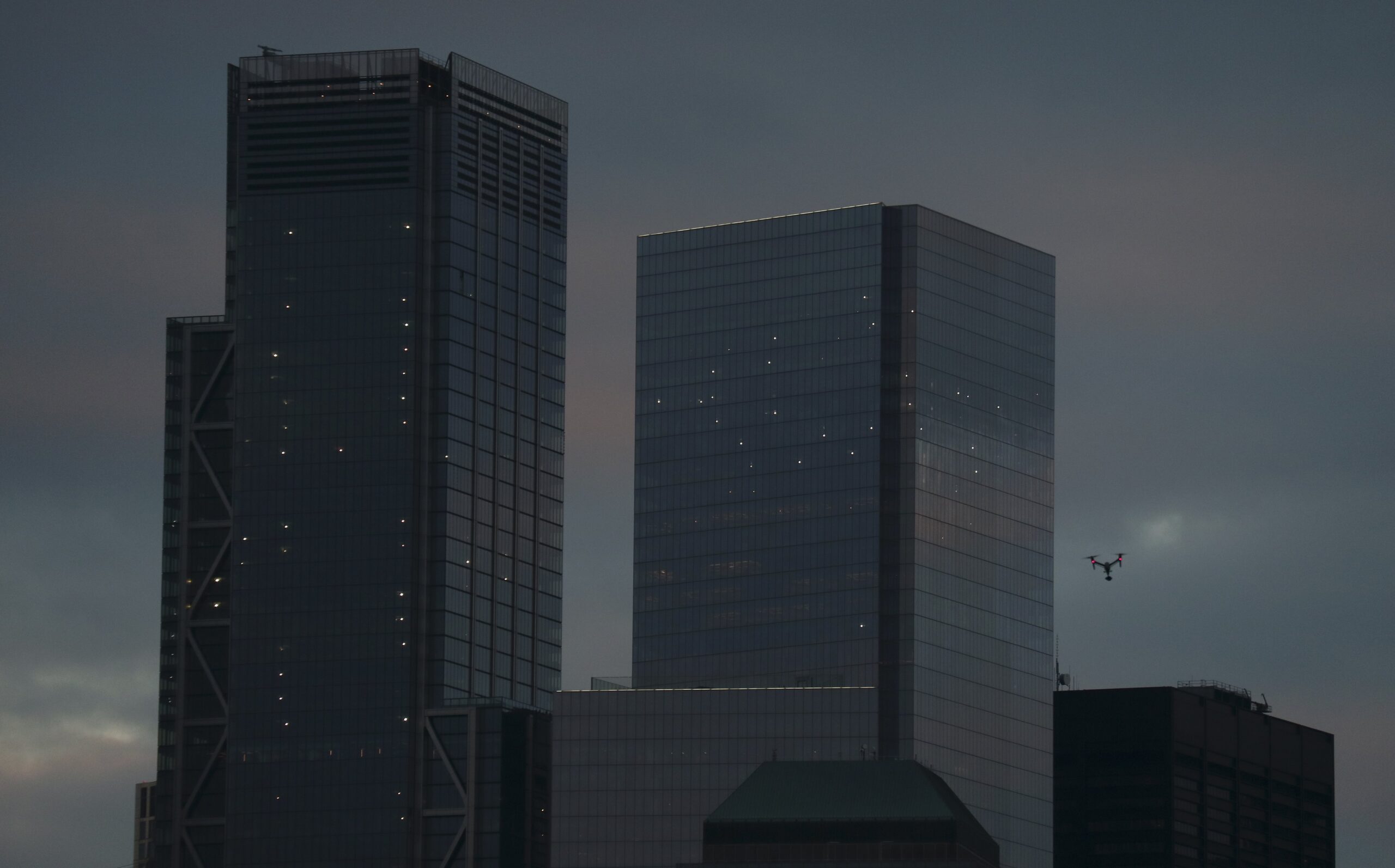 A drone flies over the Hudson River in front of 3 World Trade Center and 4 World Trade Center in New York City on November 25, 2018 as seen from Jersey City, New Jersey. 