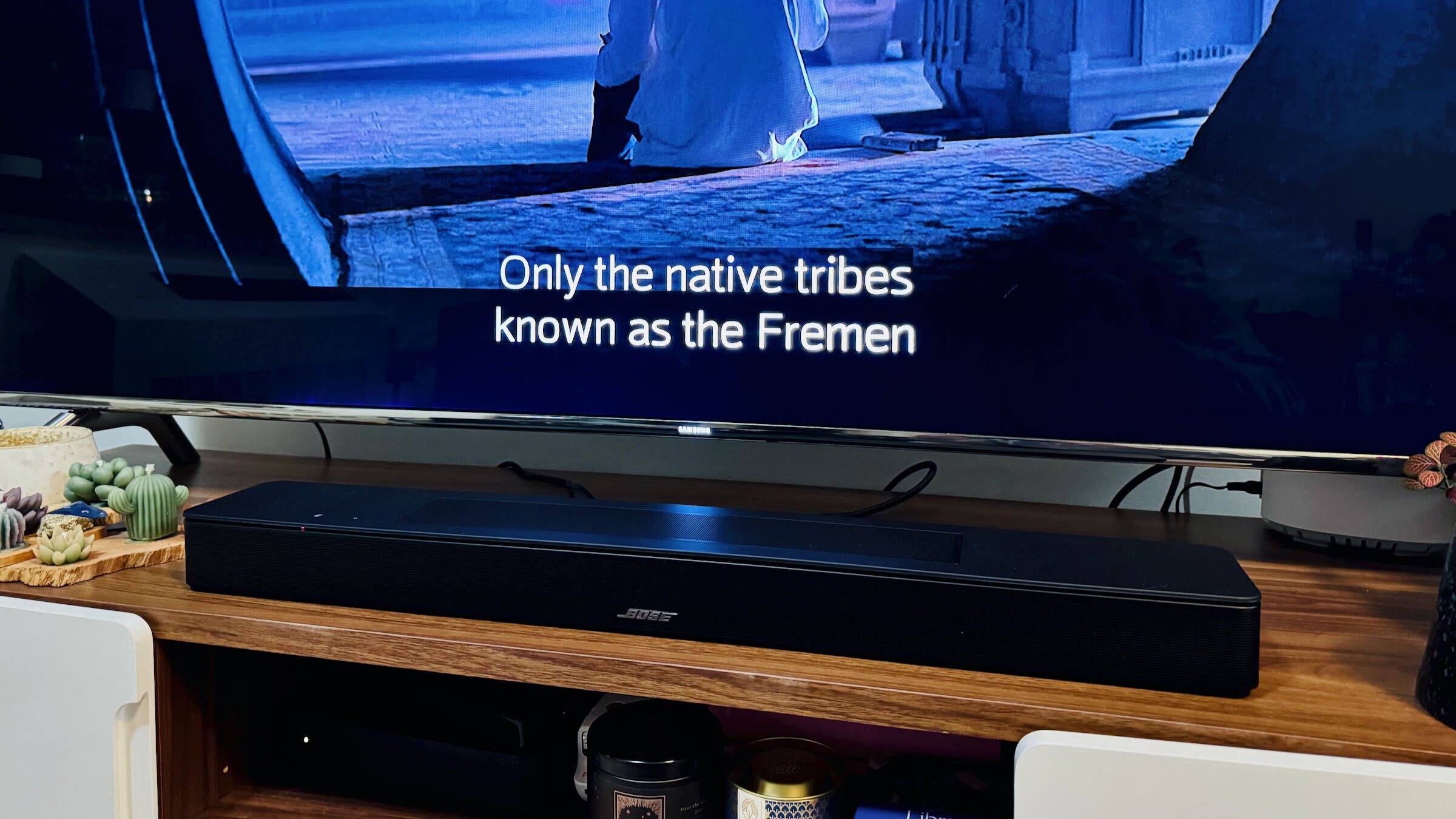 bose smart soundbar under TV playing 'dune'; text on screen reads 'only the native tribes known as fremen'