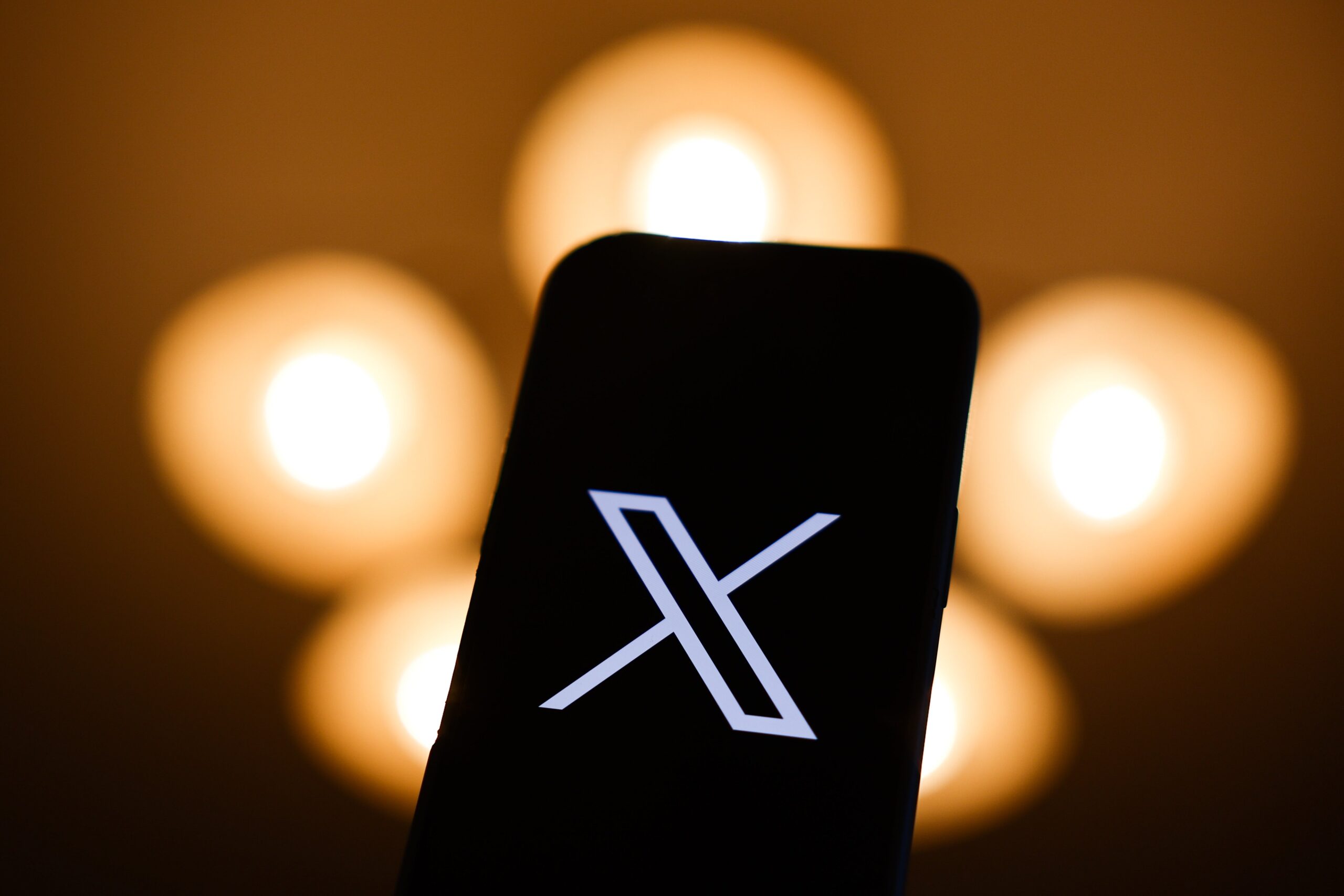 X logo on mobile device