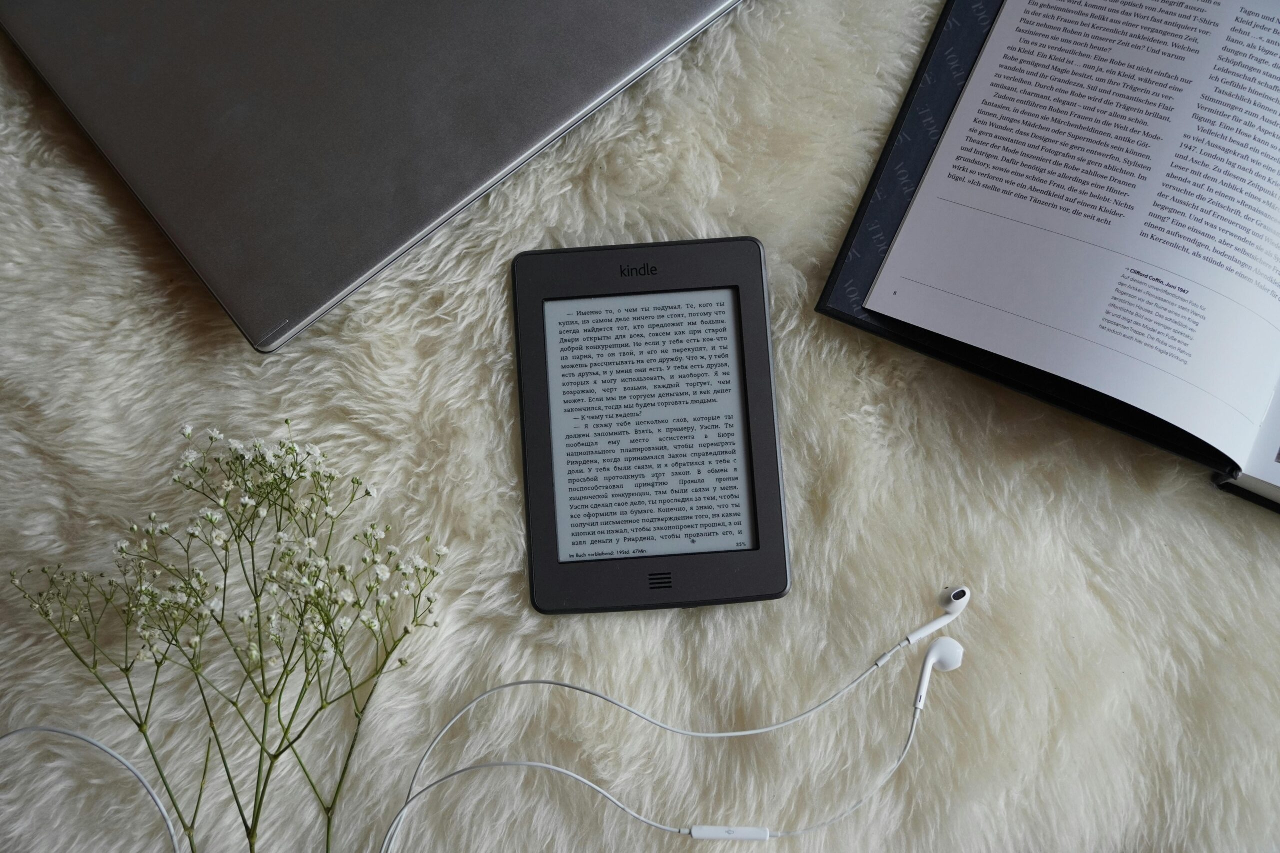 Kindle on fluffy blanket