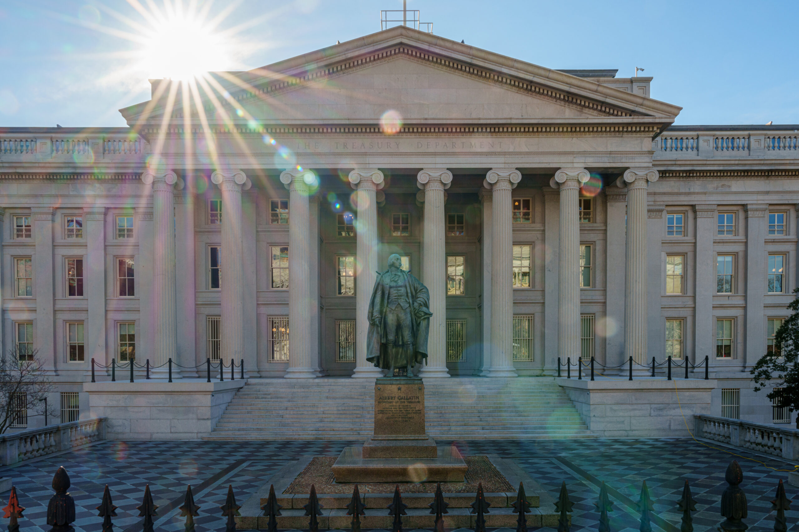  The sun flares over the headquarters of the U.S. Treasury