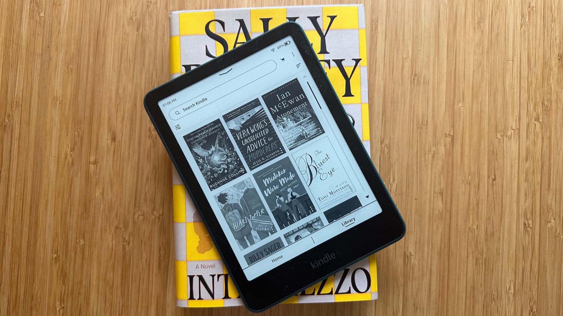 A Kindle Paperwhite on a copy of Intermezzo by Sally Rooney