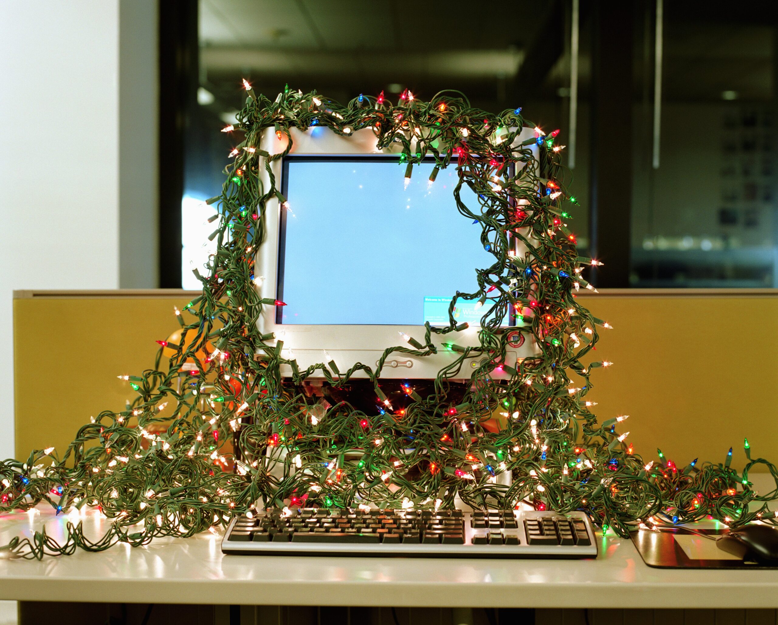 A computer rather lazily decorated for Christmas